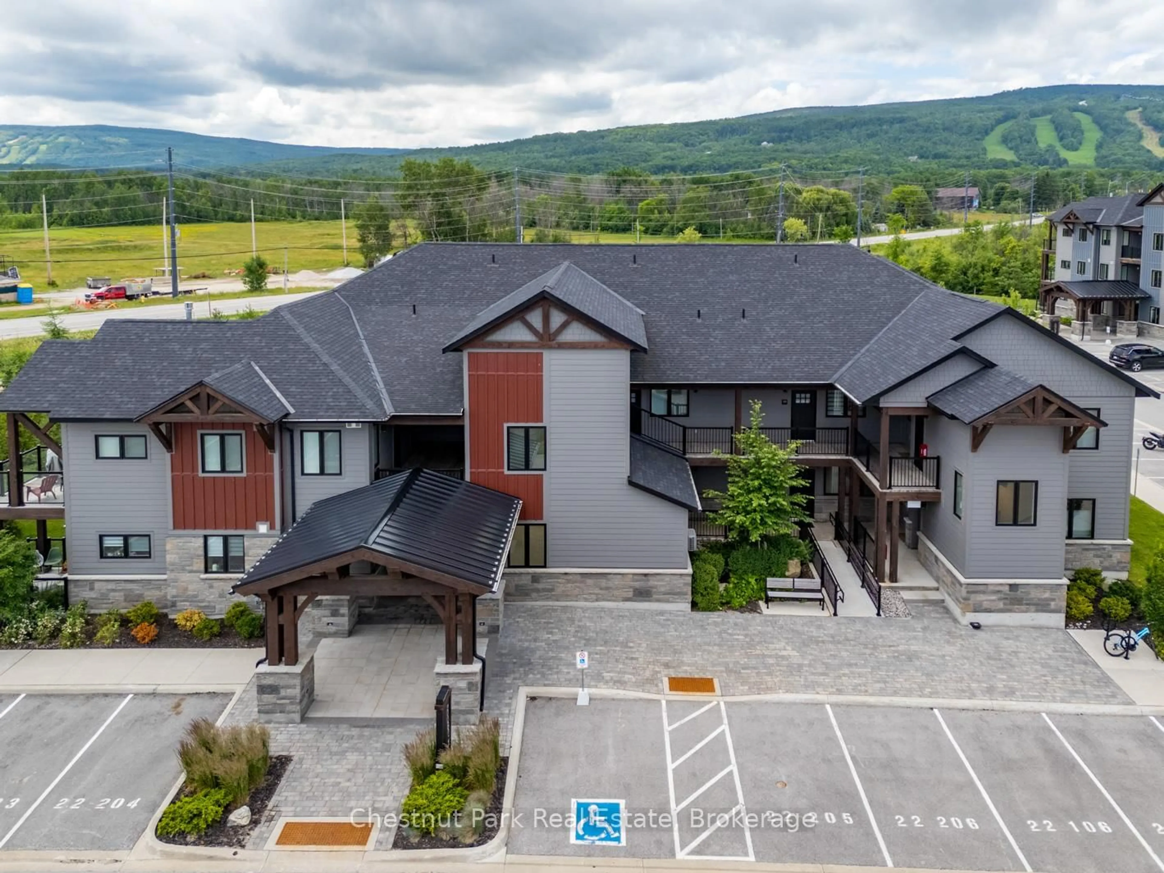A pic from outside/outdoor area/front of a property/back of a property/a pic from drone, mountain view for 22 Beckwith Lane #105, Blue Mountains Ontario L9Y 3B6