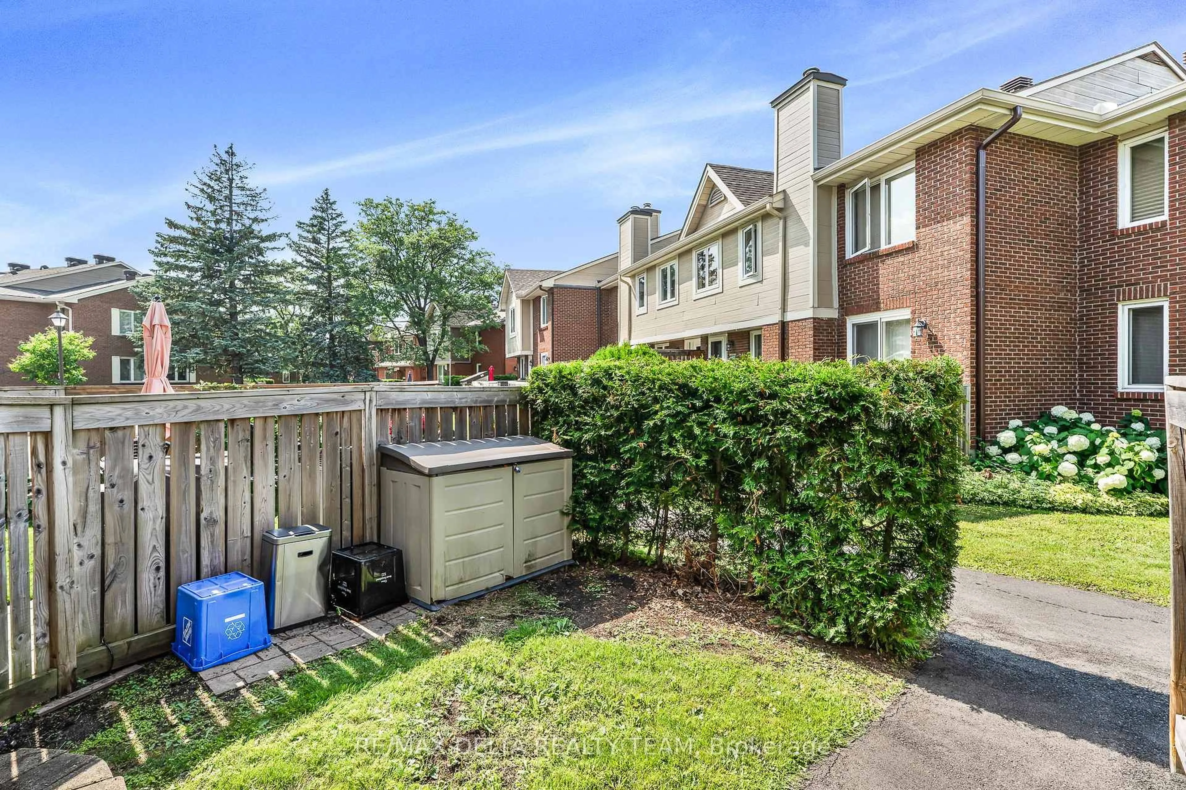 A pic from outside/outdoor area/front of a property/back of a property/a pic from drone, street for 520 Canteval Terr #205, Ottawa Ontario K4A 2C9