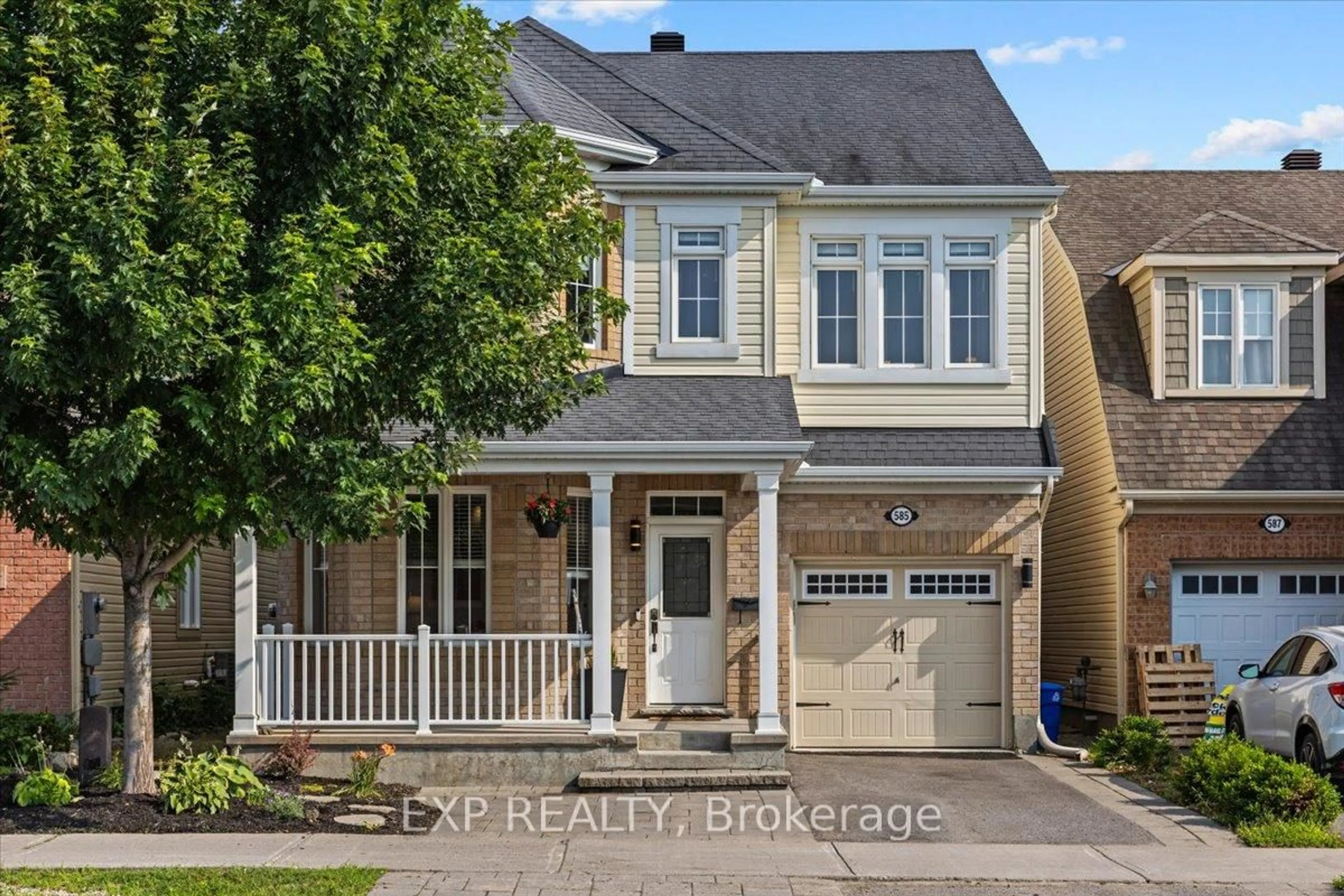 Home with vinyl exterior material, street for 585 Dundonald Dr, Ottawa Ontario K2J 5X1