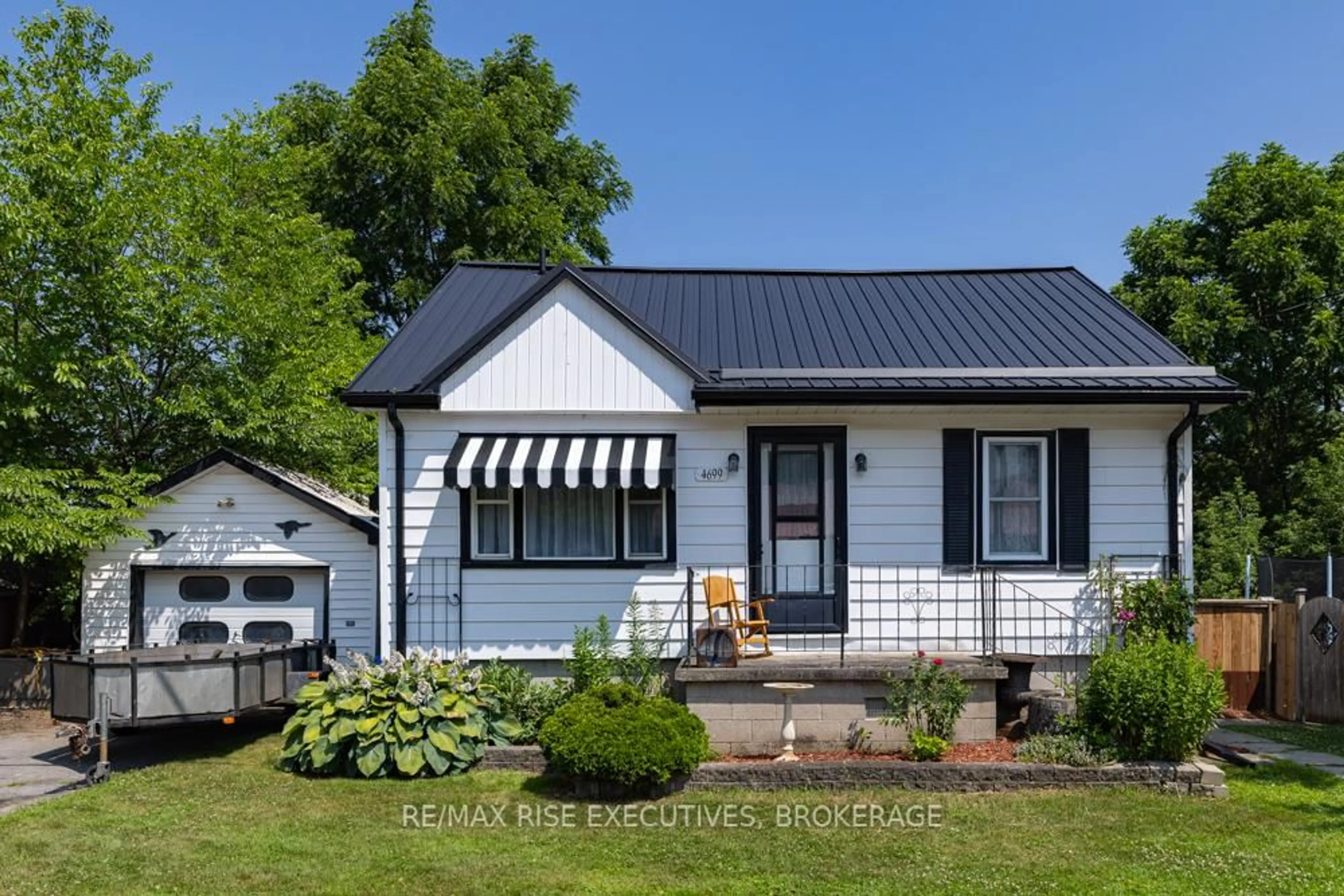 Home with vinyl exterior material, street for 4699 Latimer Rd, Inverary Ontario K0H 1X0