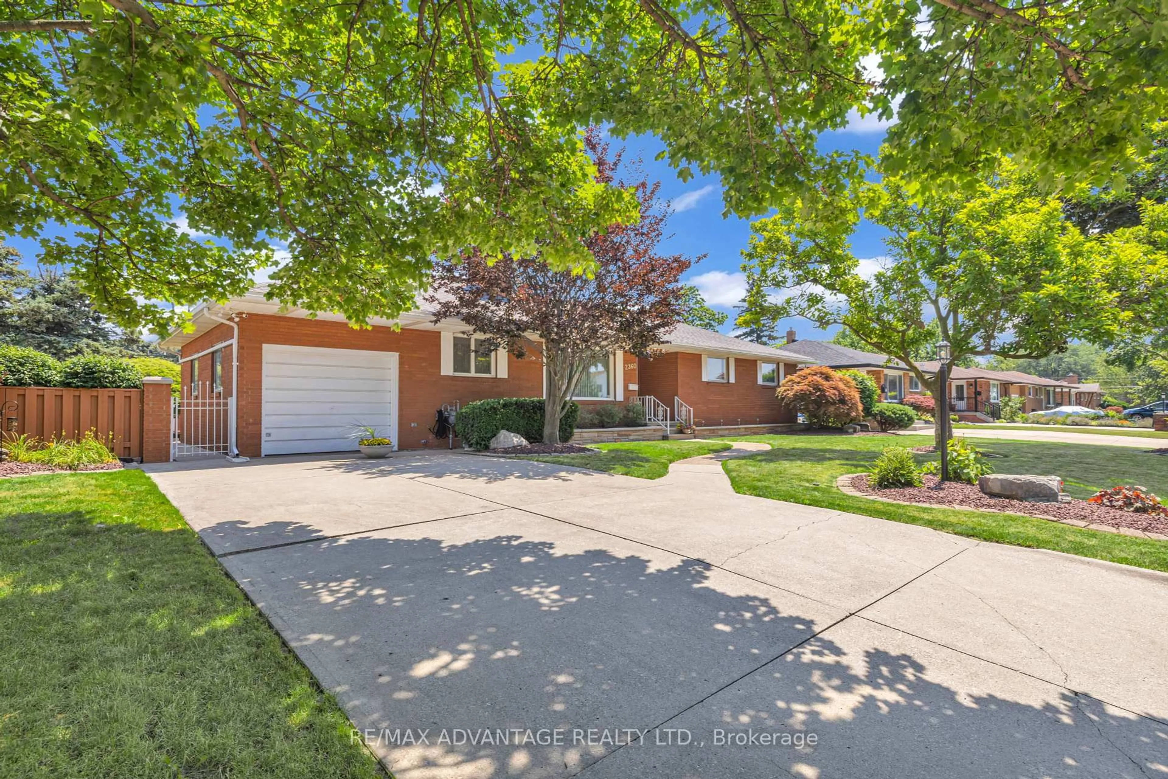 Home with brick exterior material, street for 2360 Leonard Rd, Windsor Ontario N8W 4L7
