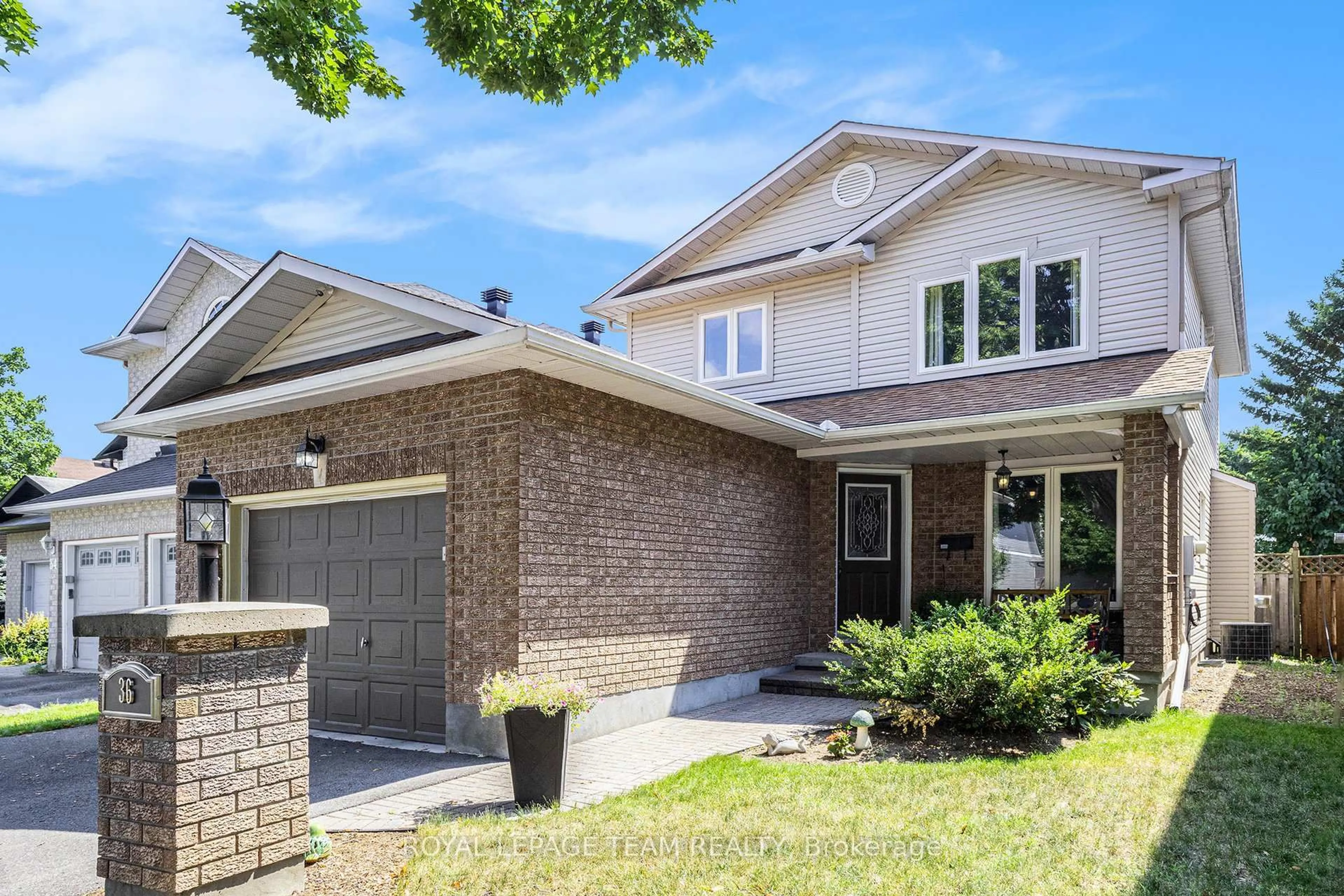 Home with brick exterior material, street for 36 Nakota Way, Ottawa Ontario K2J 4M3