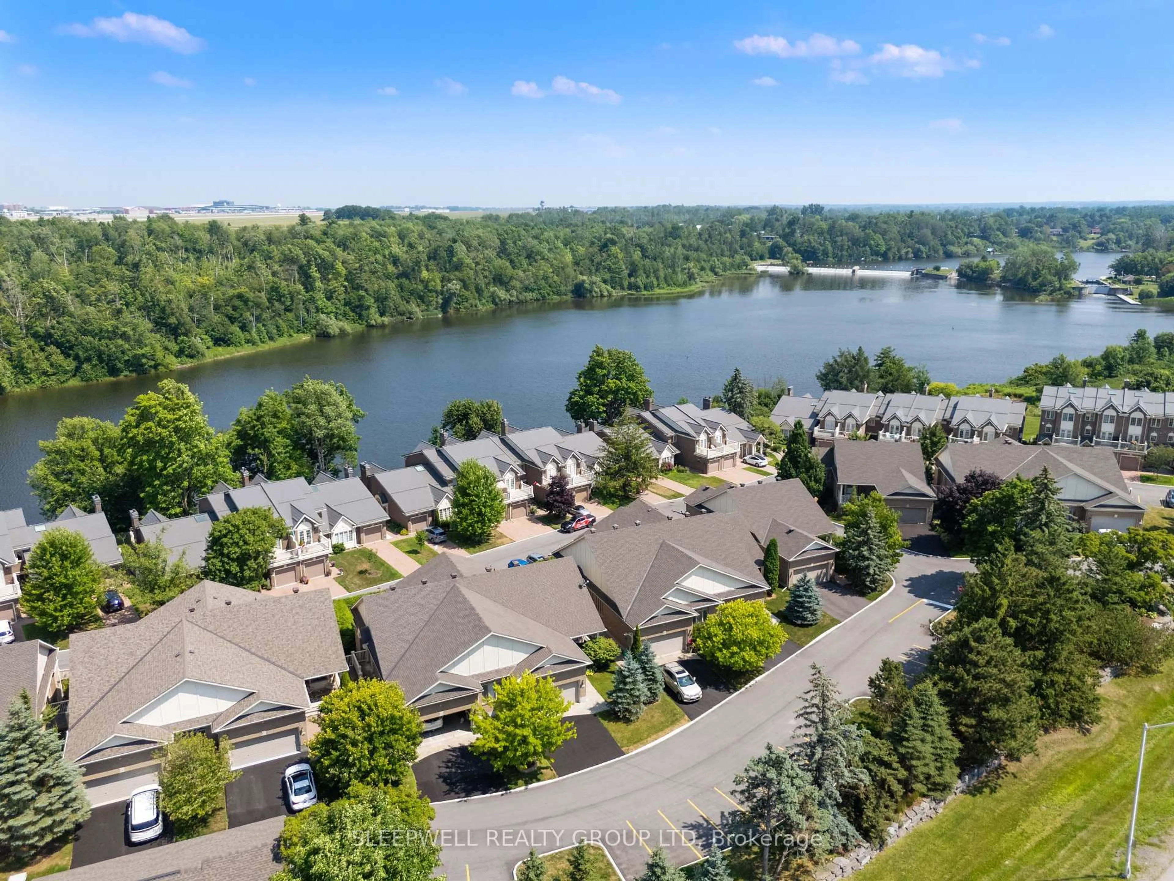 A pic from outside/outdoor area/front of a property/back of a property/a pic from drone, water/lake/river/ocean view for 55 Waterford Dr, Ottawa Ontario K2E 7V4