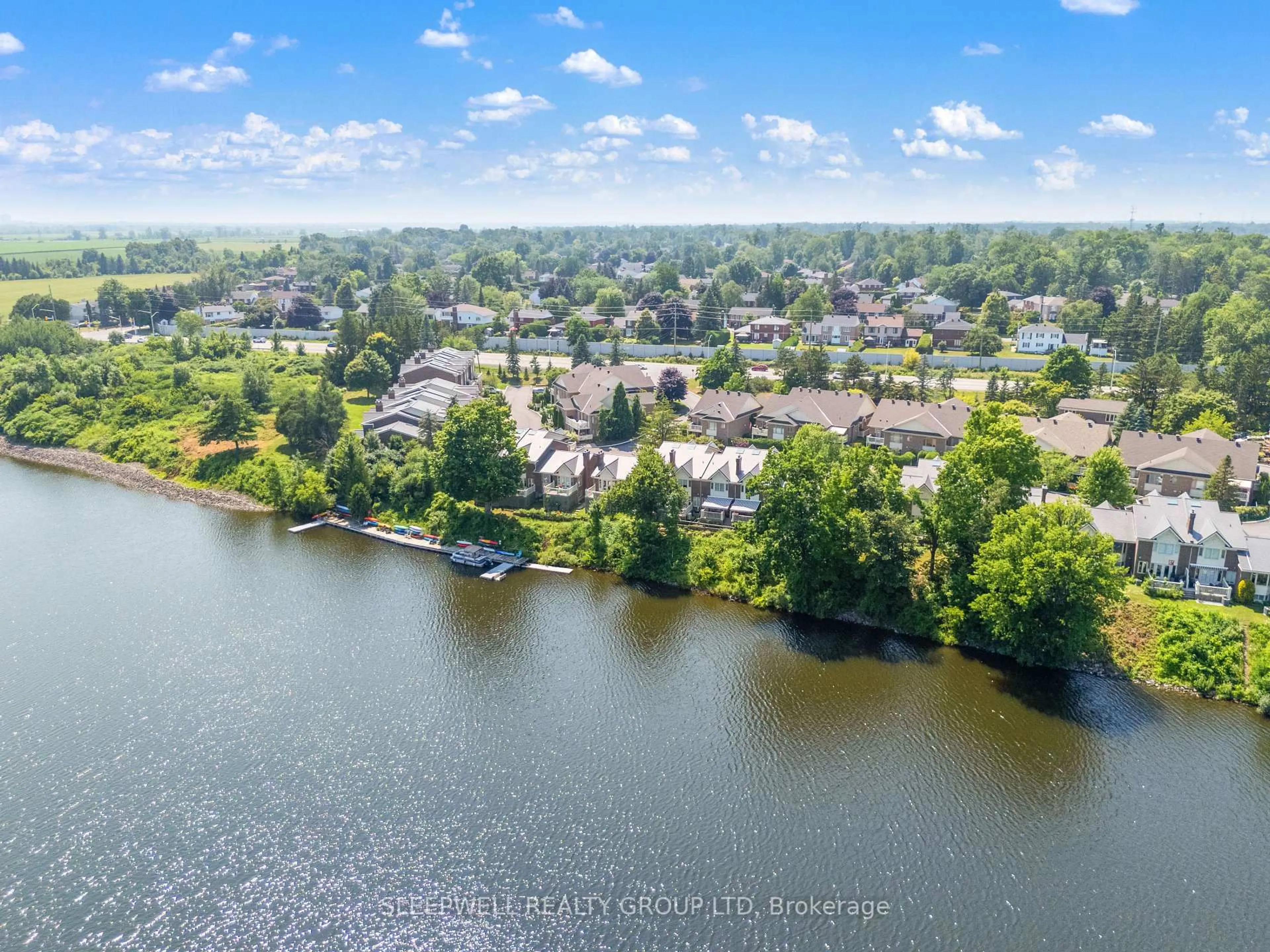 A pic from outside/outdoor area/front of a property/back of a property/a pic from drone, water/lake/river/ocean view for 55 Waterford Dr, Ottawa Ontario K2E 7V4