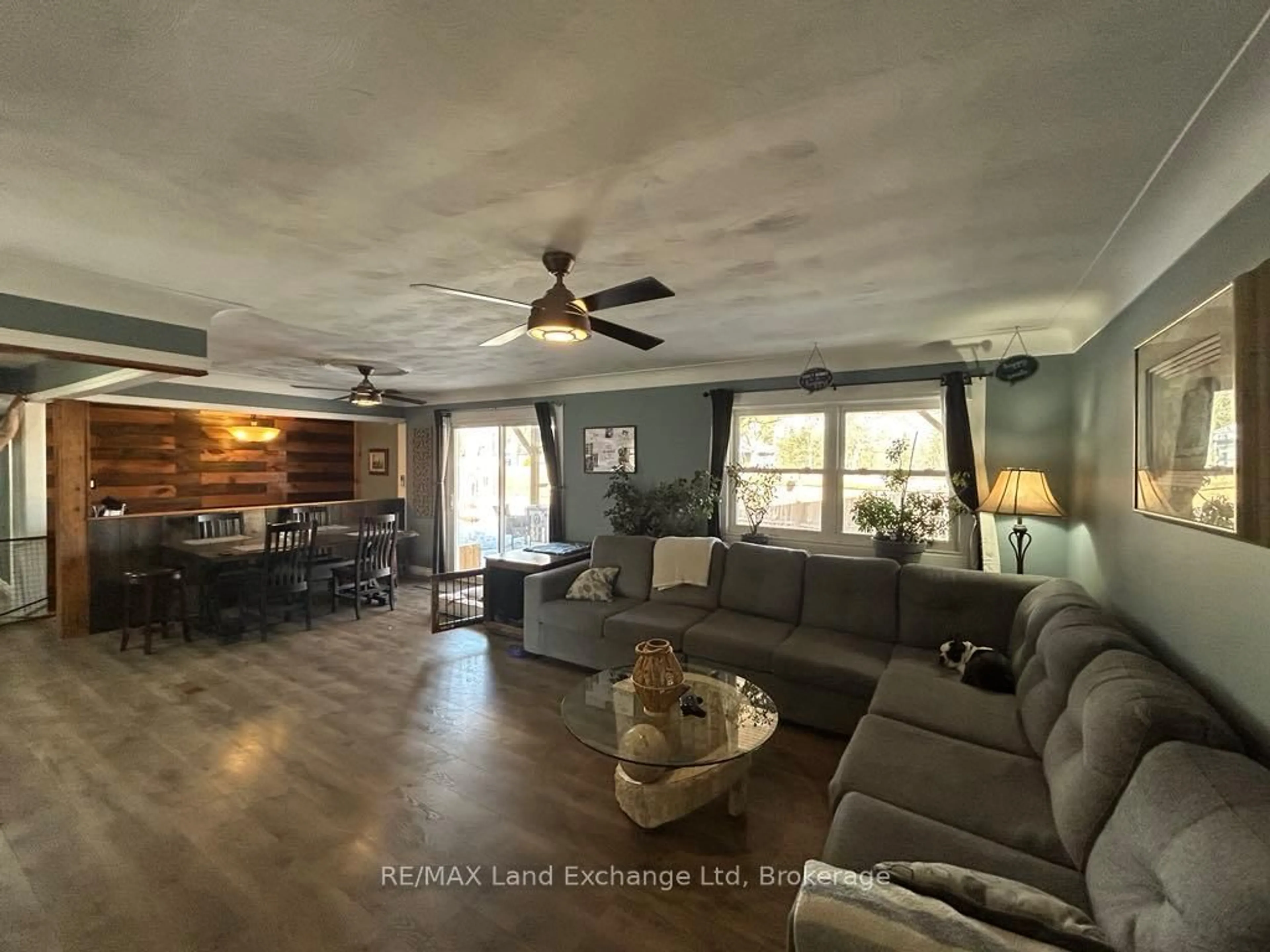 Living room with furniture, wood/laminate floor for 1041 Main St, Howick Ontario N0G 2X0