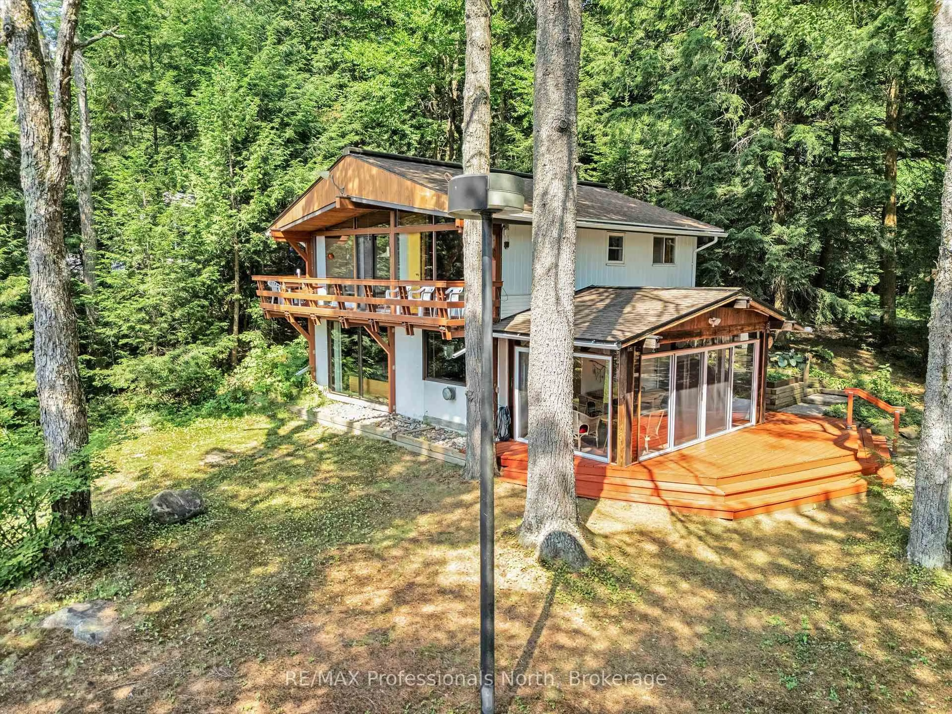 A pic from outside/outdoor area/front of a property/back of a property/a pic from drone, forest/trees view for 1122 Pine Lake Shores Rd, Bracebridge Ontario P1L 1X3
