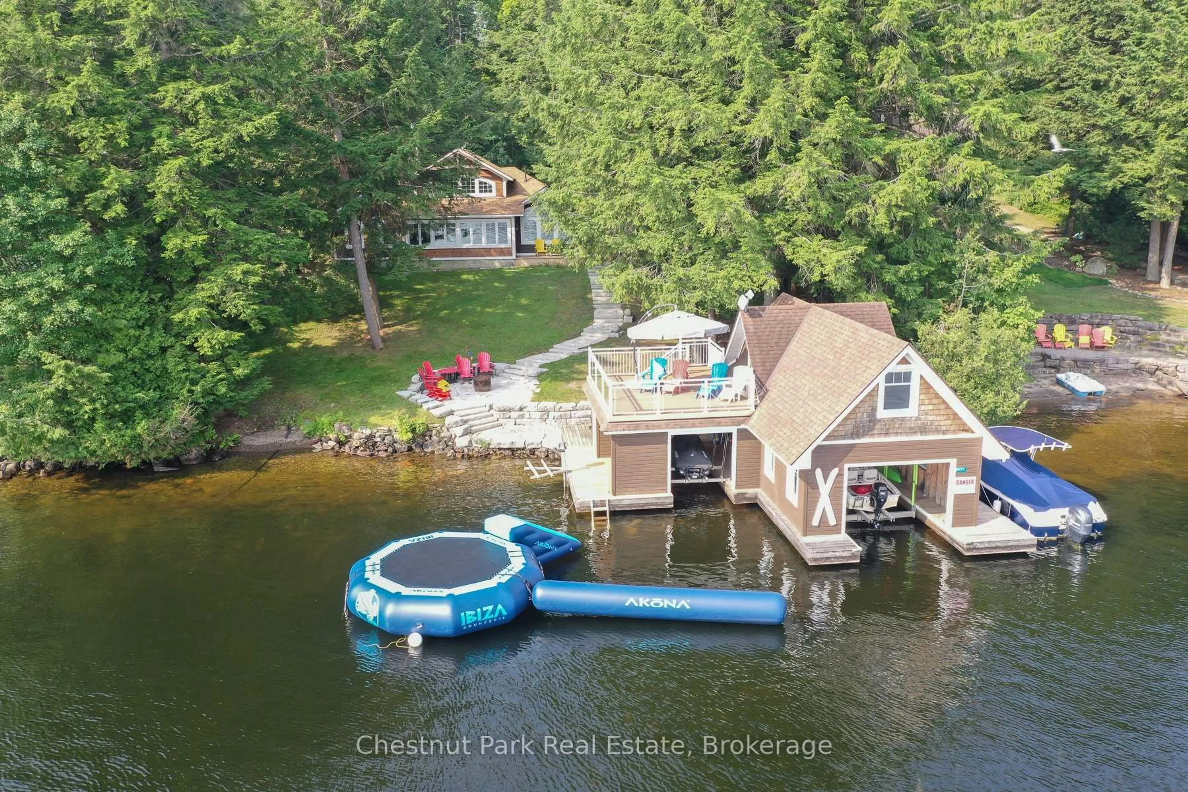 A pic from outside/outdoor area/front of a property/back of a property/a pic from drone, water/lake/river/ocean view for 1171 Parkers Point Rd, Gravenhurst Ontario P1P 1R2