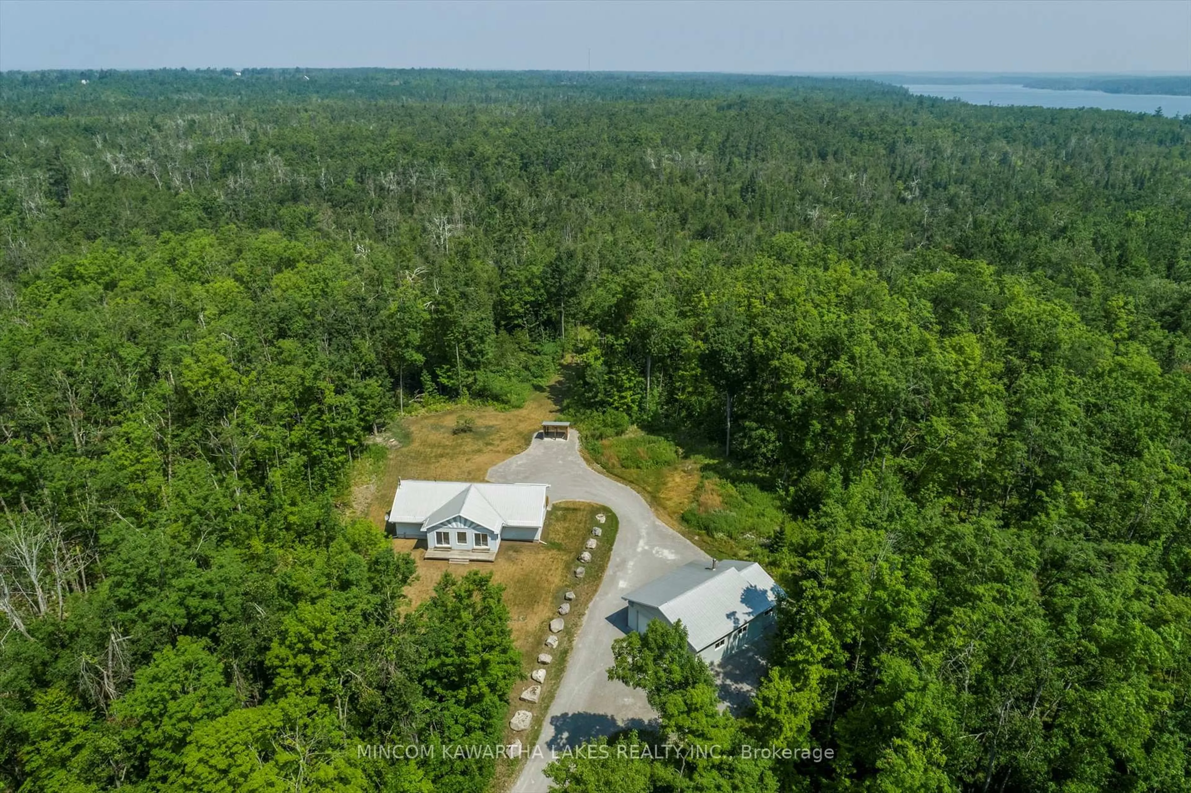 A pic from outside/outdoor area/front of a property/back of a property/a pic from drone, forest/trees view for 947 Lakehurst Rd, Trent Lakes Ontario K0L 1J0