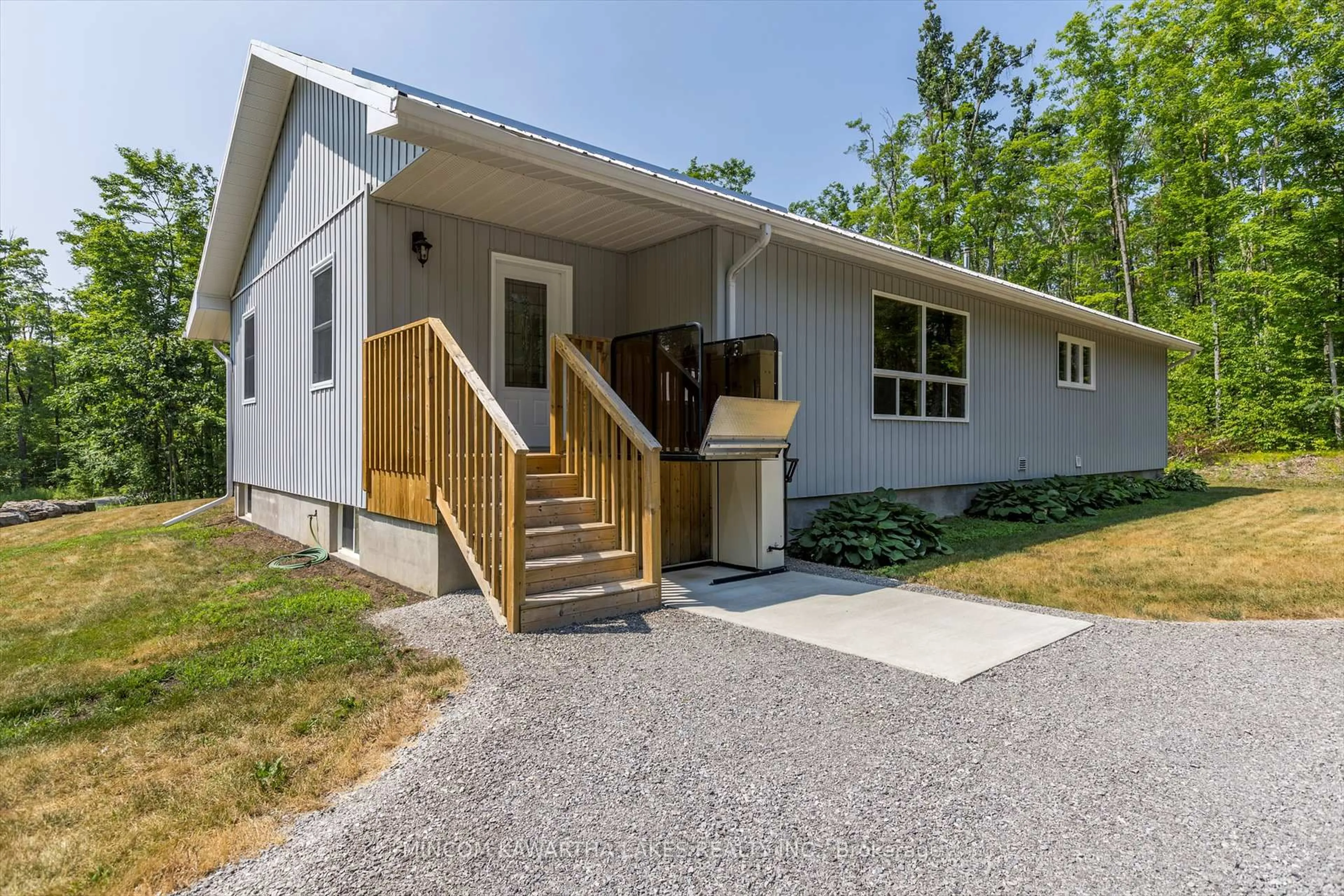 Home with vinyl exterior material, street for 947 Lakehurst Rd, Trent Lakes Ontario K0L 1J0