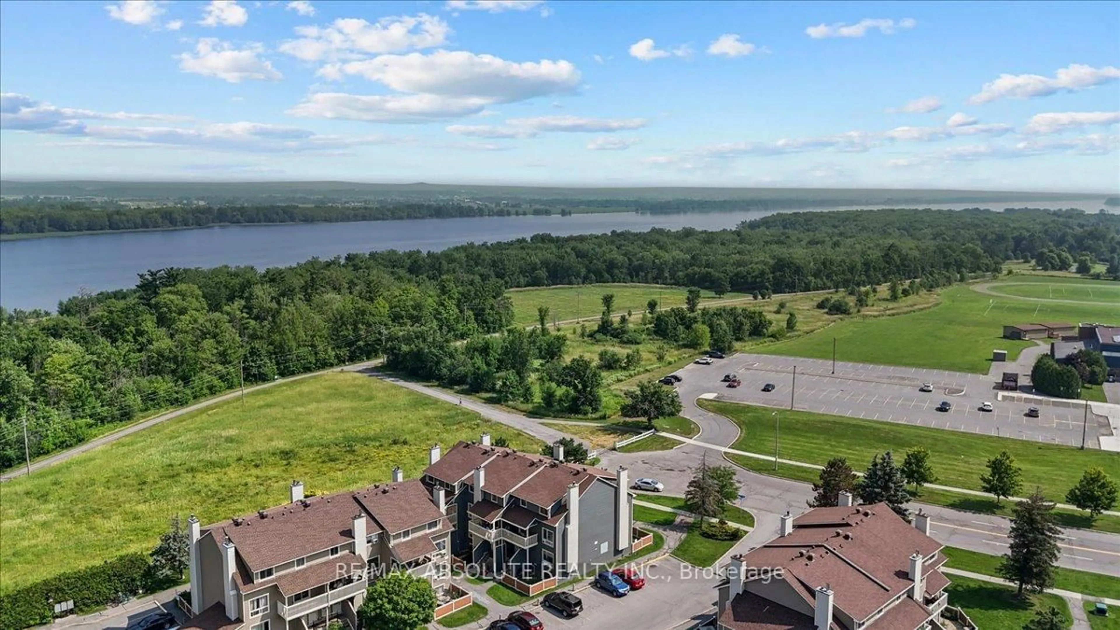 A pic from outside/outdoor area/front of a property/back of a property/a pic from drone, water/lake/river/ocean view for 750 St. Andre Dr #69A, Ottawa Ontario K1C 4S2
