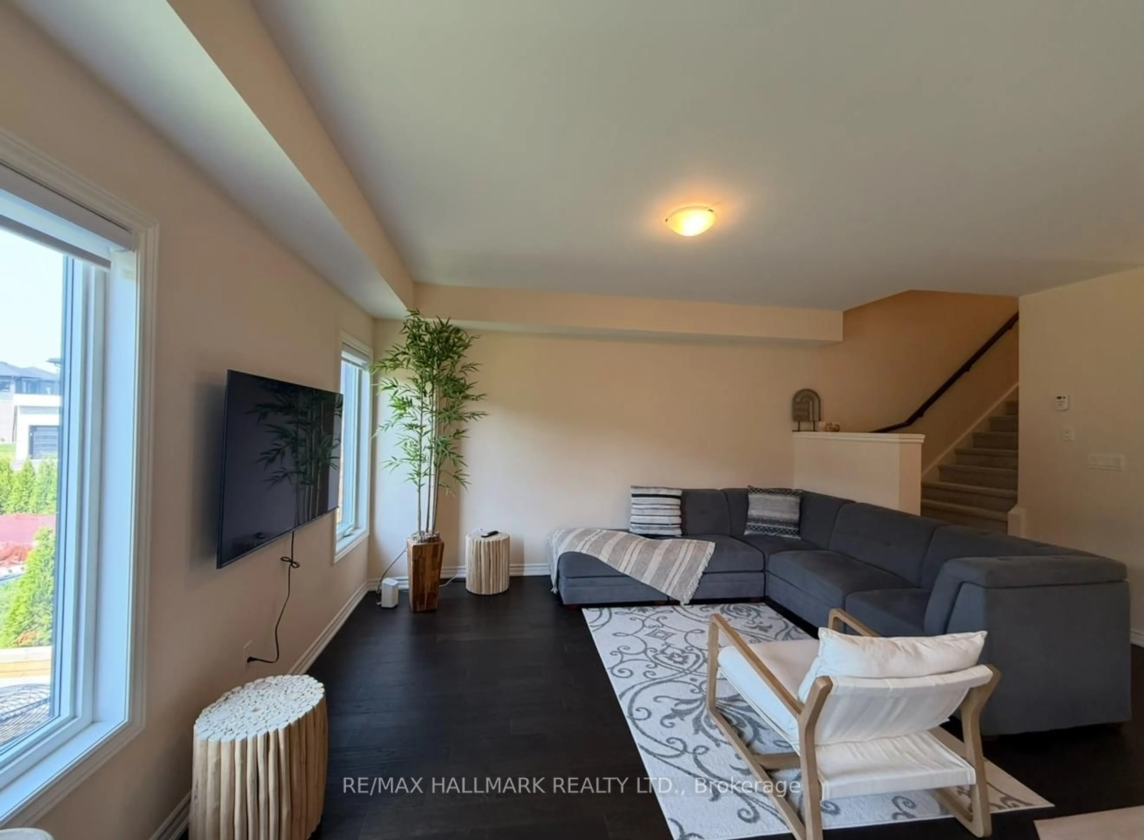 Living room with furniture, wood/laminate floor for 151 Rosie St #81, Blue Mountains Ontario N0H 1J0