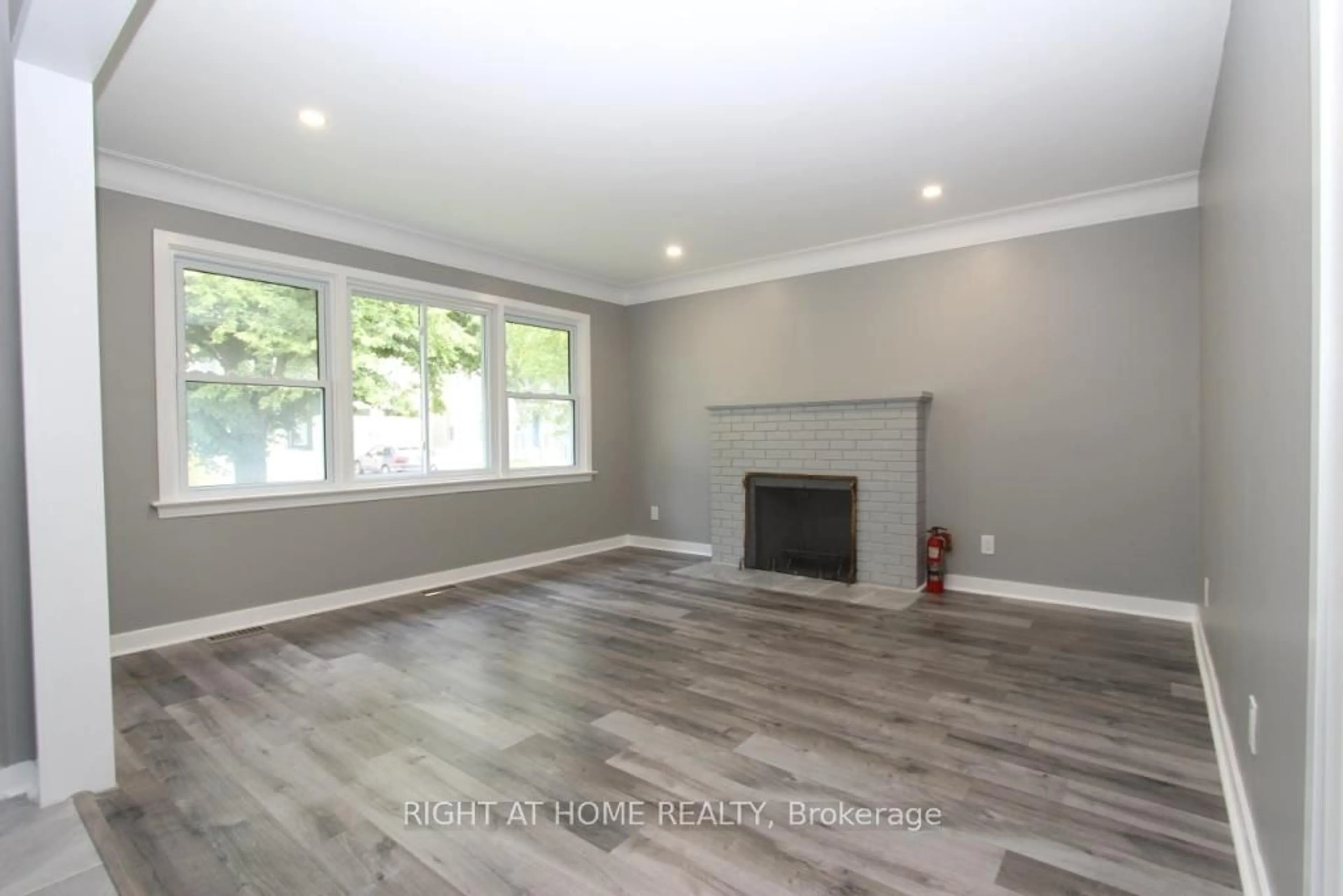 Living room with furniture, wood/laminate floor for 2216 Prospect Ave, Ottawa Ontario K1H 7G3