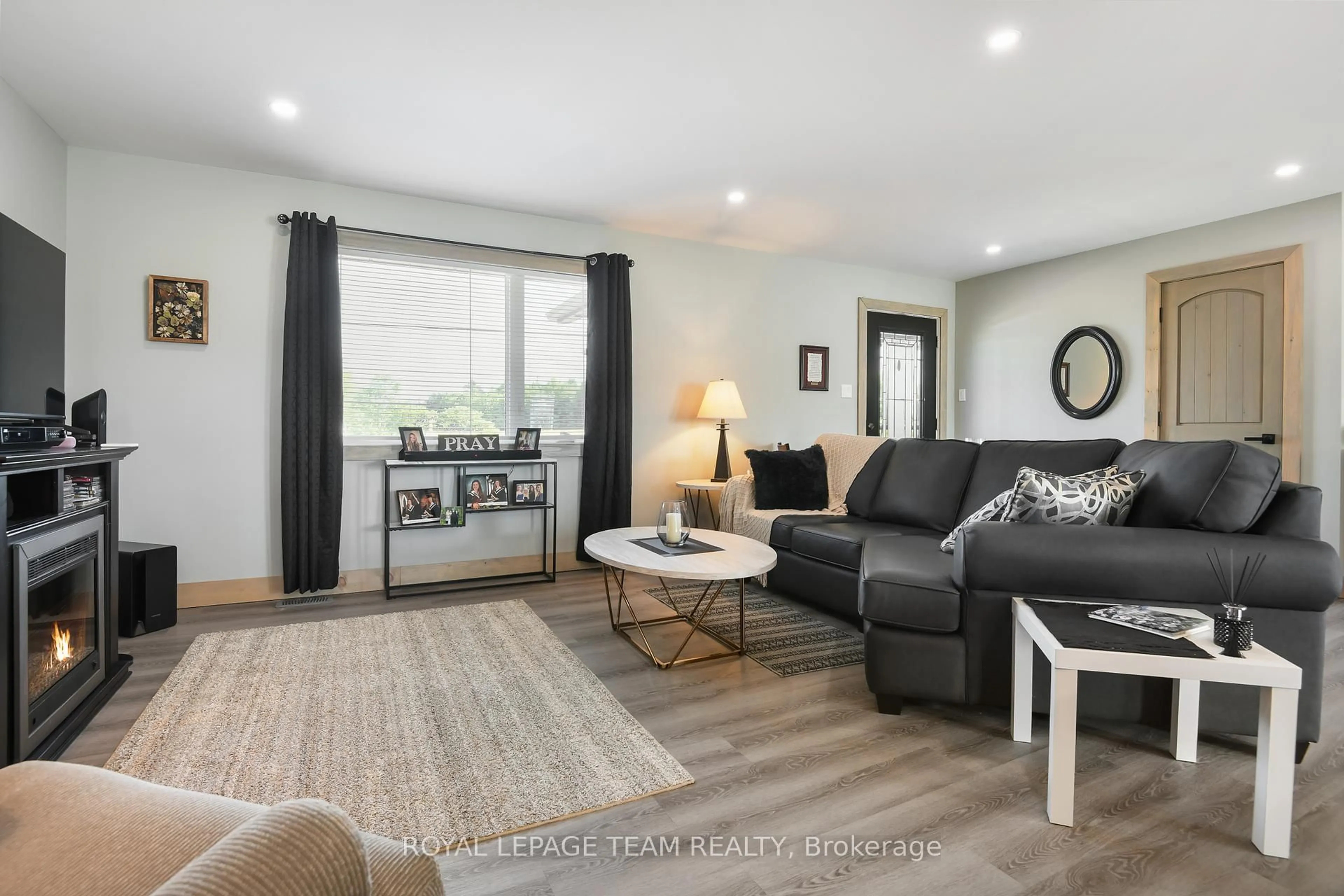 Living room with furniture, wood/laminate floor for 1016 Castleford Rd, Renfrew Ontario K7V 3Z8