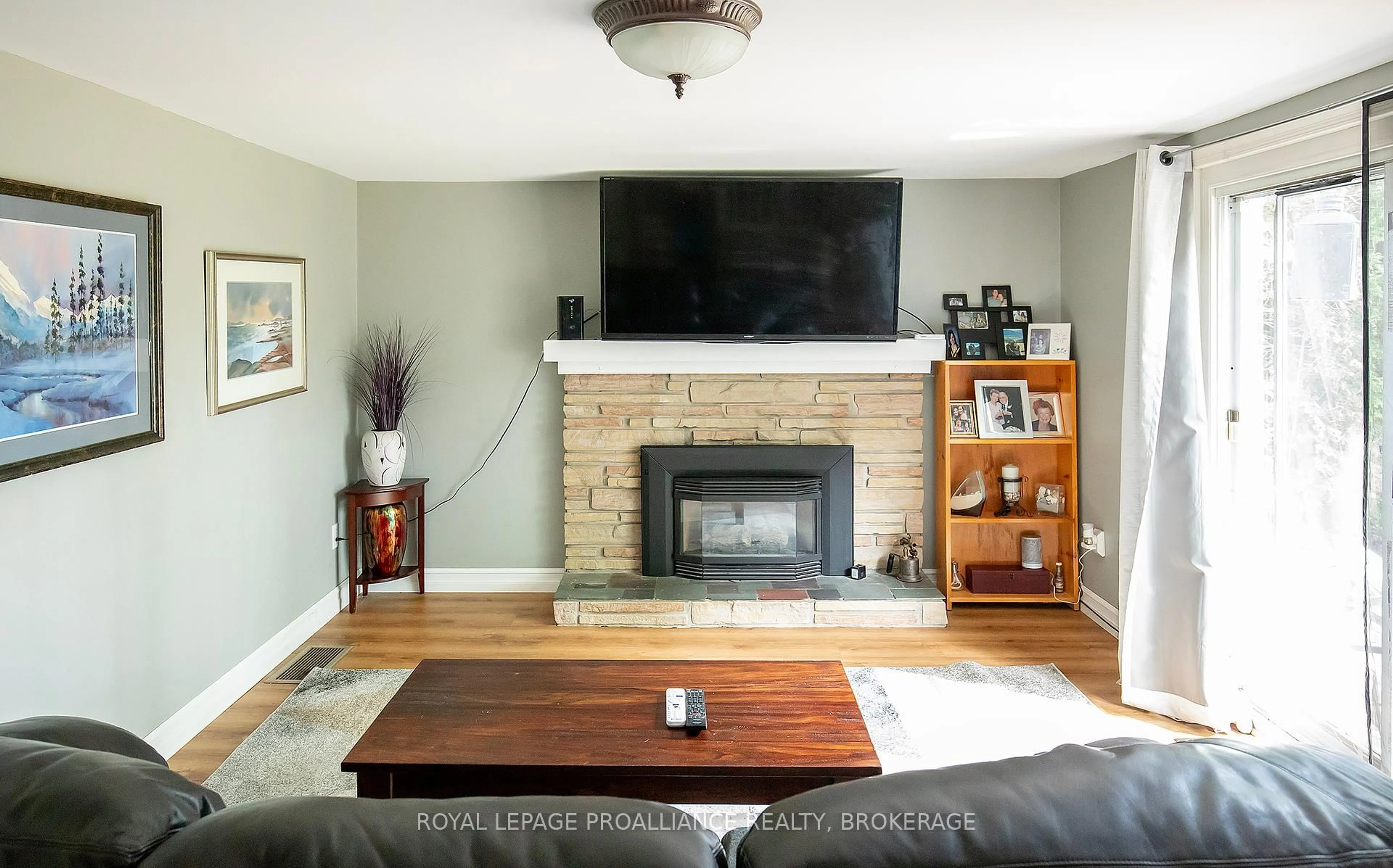 Living room with furniture, wood/laminate floor for 296 Olympus Ave, Kingston Ontario K7M 4T9