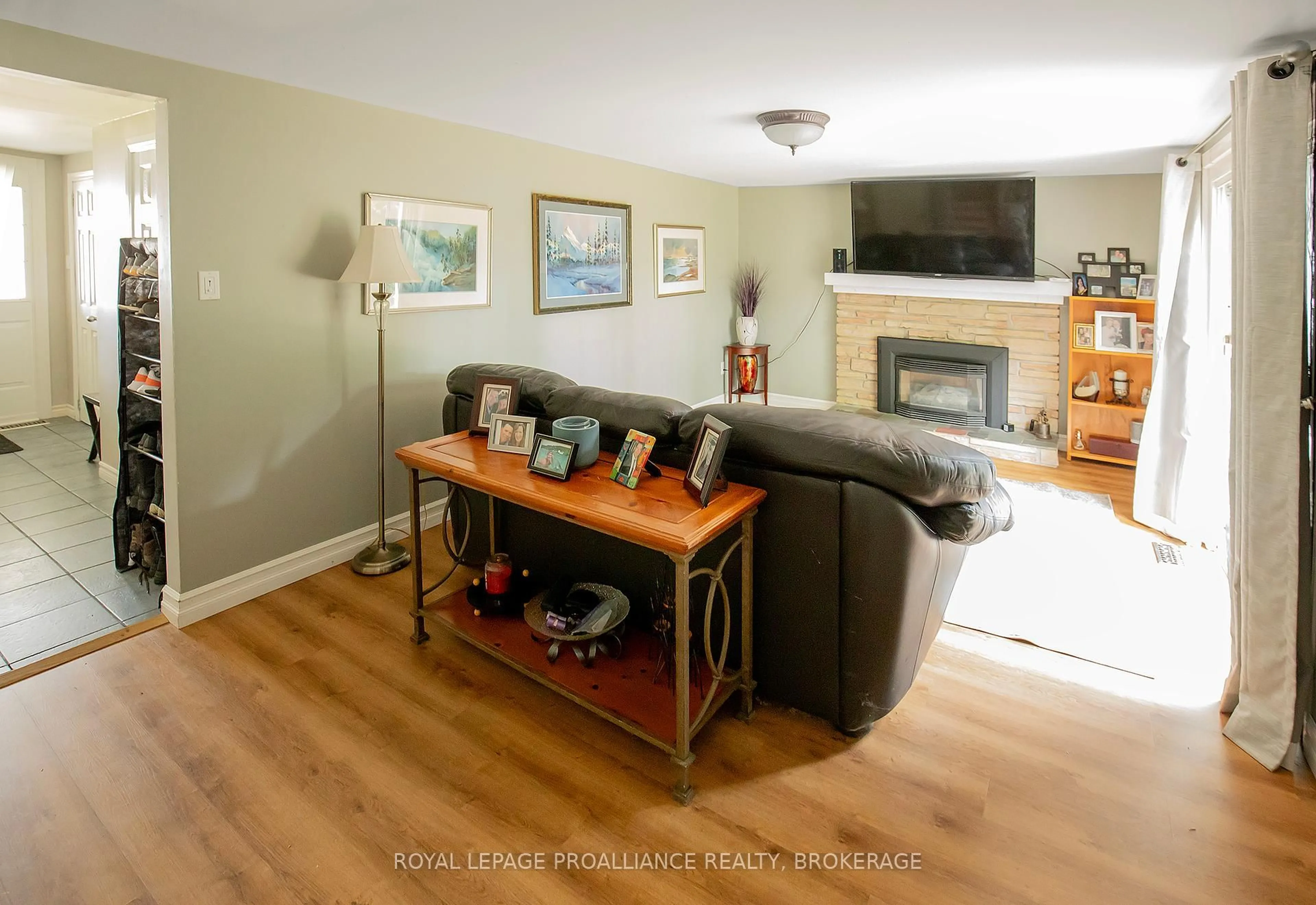 Living room with furniture, wood/laminate floor for 296 Olympus Ave, Kingston Ontario K7M 4T9