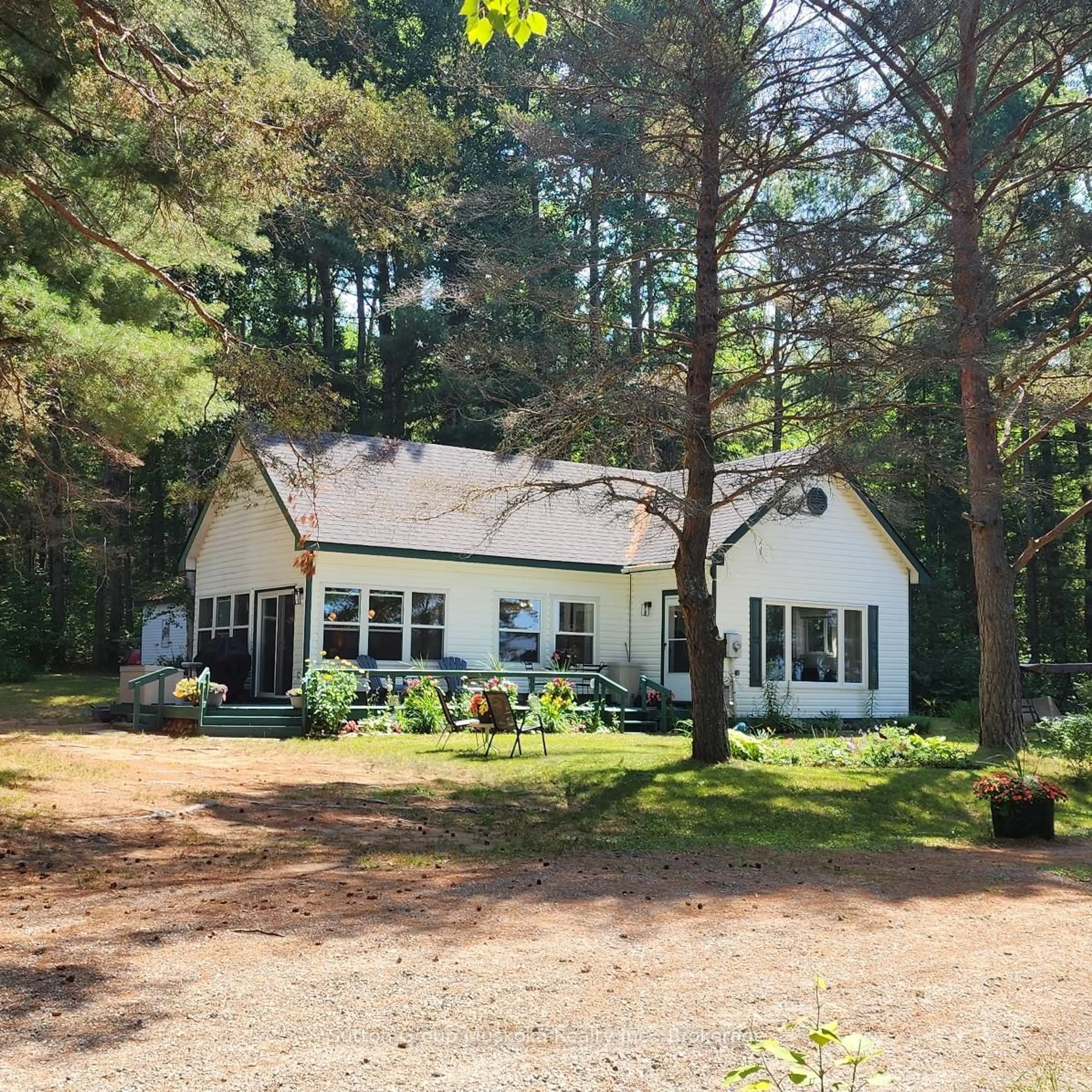 A pic from outside/outdoor area/front of a property/back of a property/a pic from drone, forest/trees view for 1060 - 6 Seabreeze Rd, Lake of Bays Ontario P0A 1H0