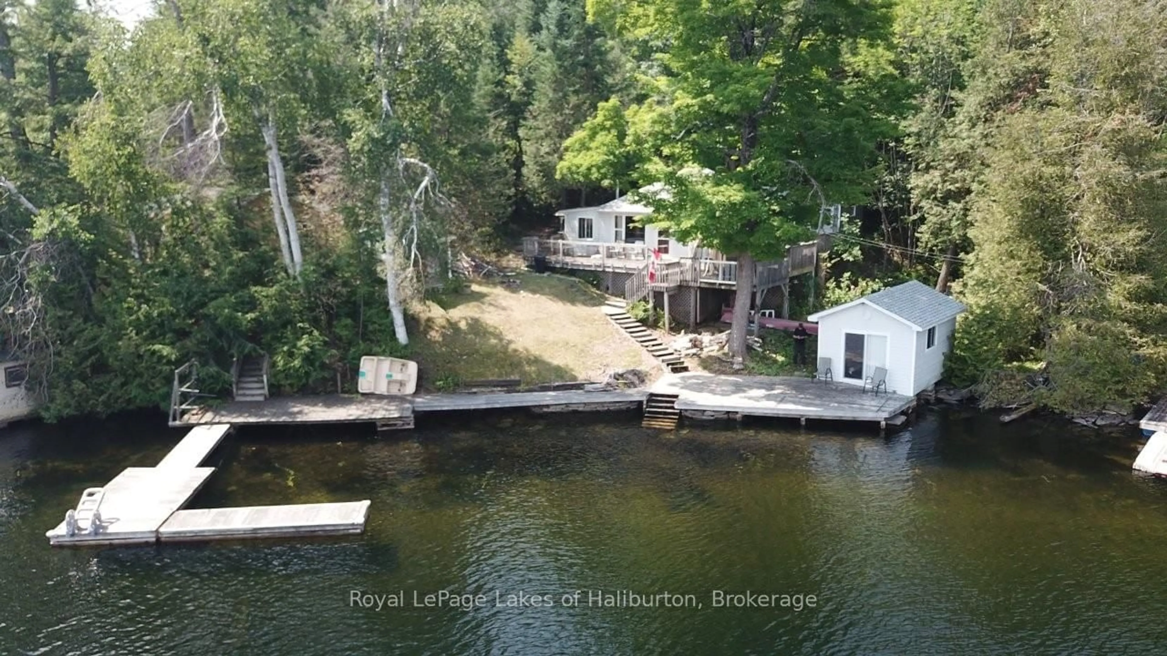 A pic from outside/outdoor area/front of a property/back of a property/a pic from drone, water/lake/river/ocean view for 39 FR 393 (Lakeside Dr) Dr, Trent Lakes Ontario K0M 2A0
