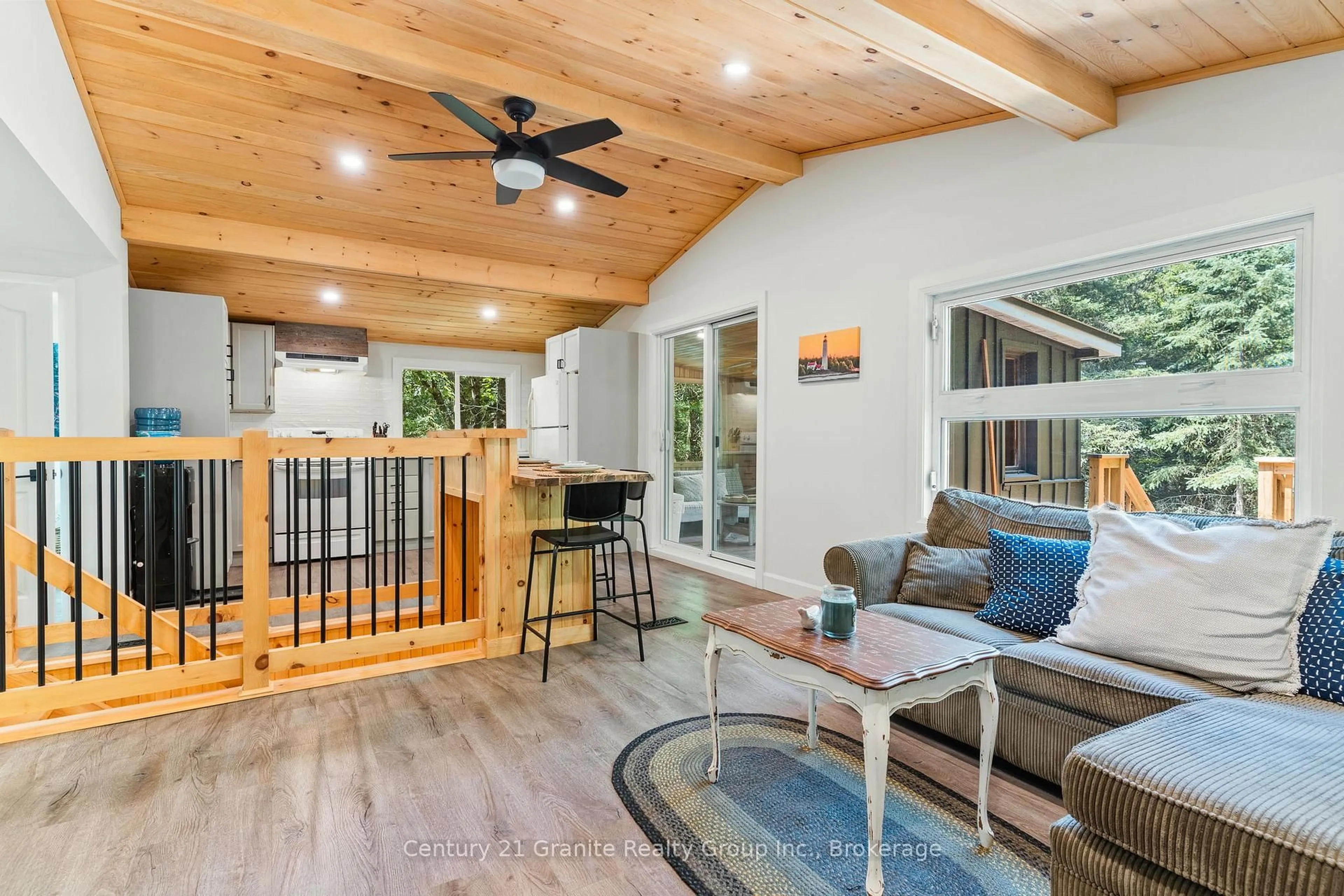 Open concept kitchen, wood/laminate floor for 10979 Highway 118, Algonquin Highlands Ontario K0M 1S0