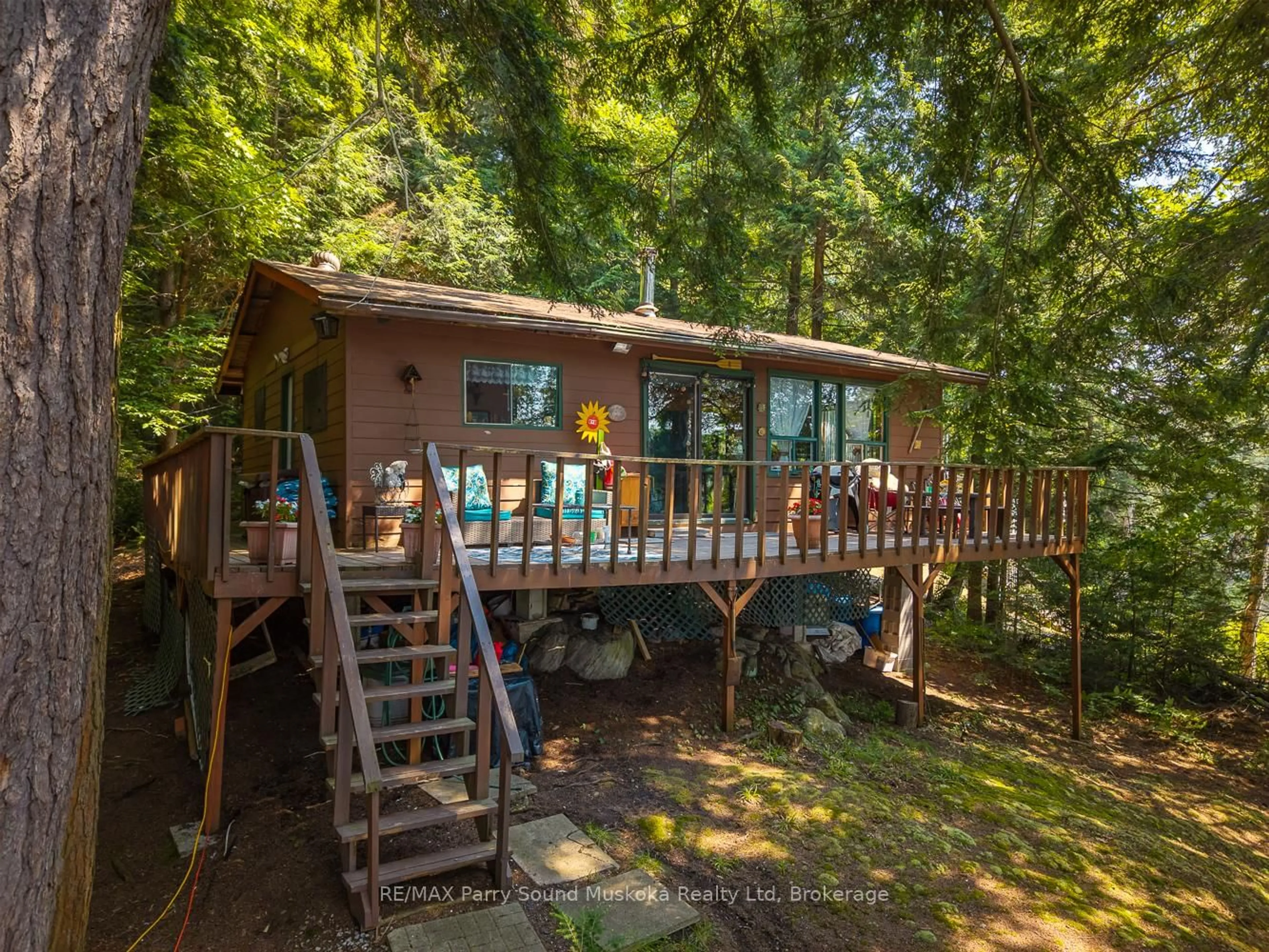 A pic from outside/outdoor area/front of a property/back of a property/a pic from drone, forest/trees view for 20 Peninsula Tr, Seguin Ontario P2A 2W8