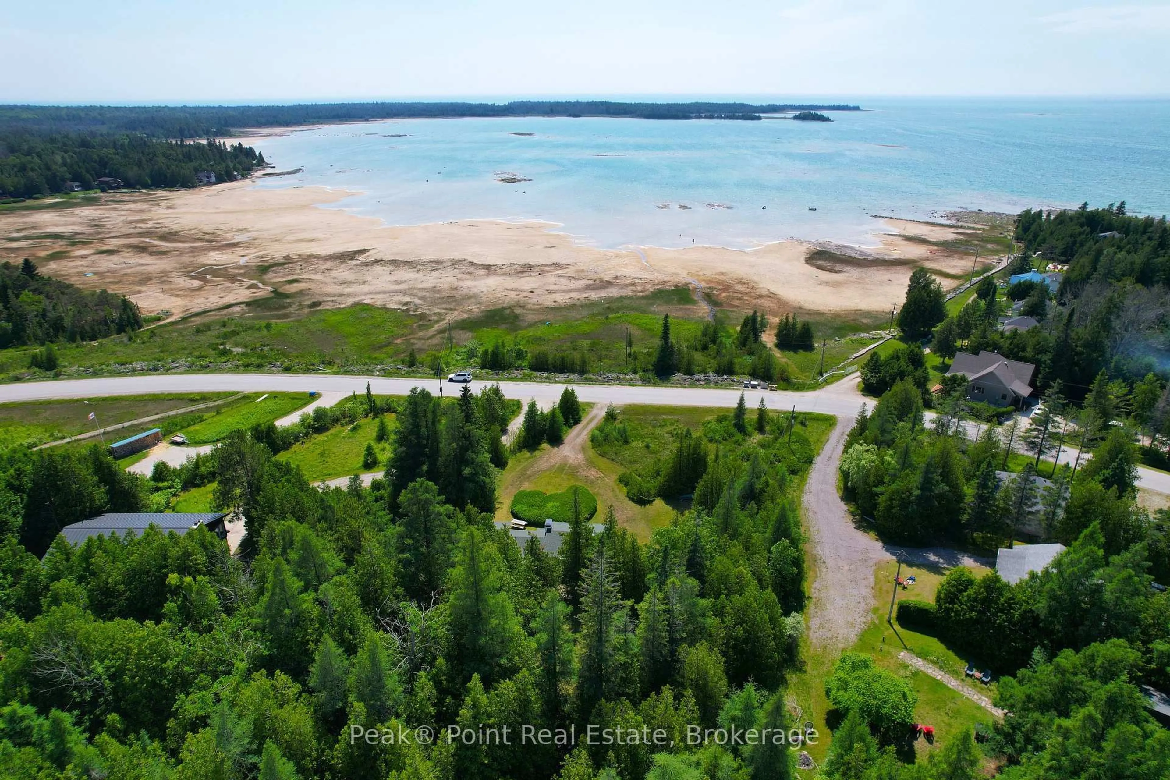 A pic from outside/outdoor area/front of a property/back of a property/a pic from drone, water/lake/river/ocean view for 503 Bay St, South Bruce Peninsula Ontario N0H 2T0
