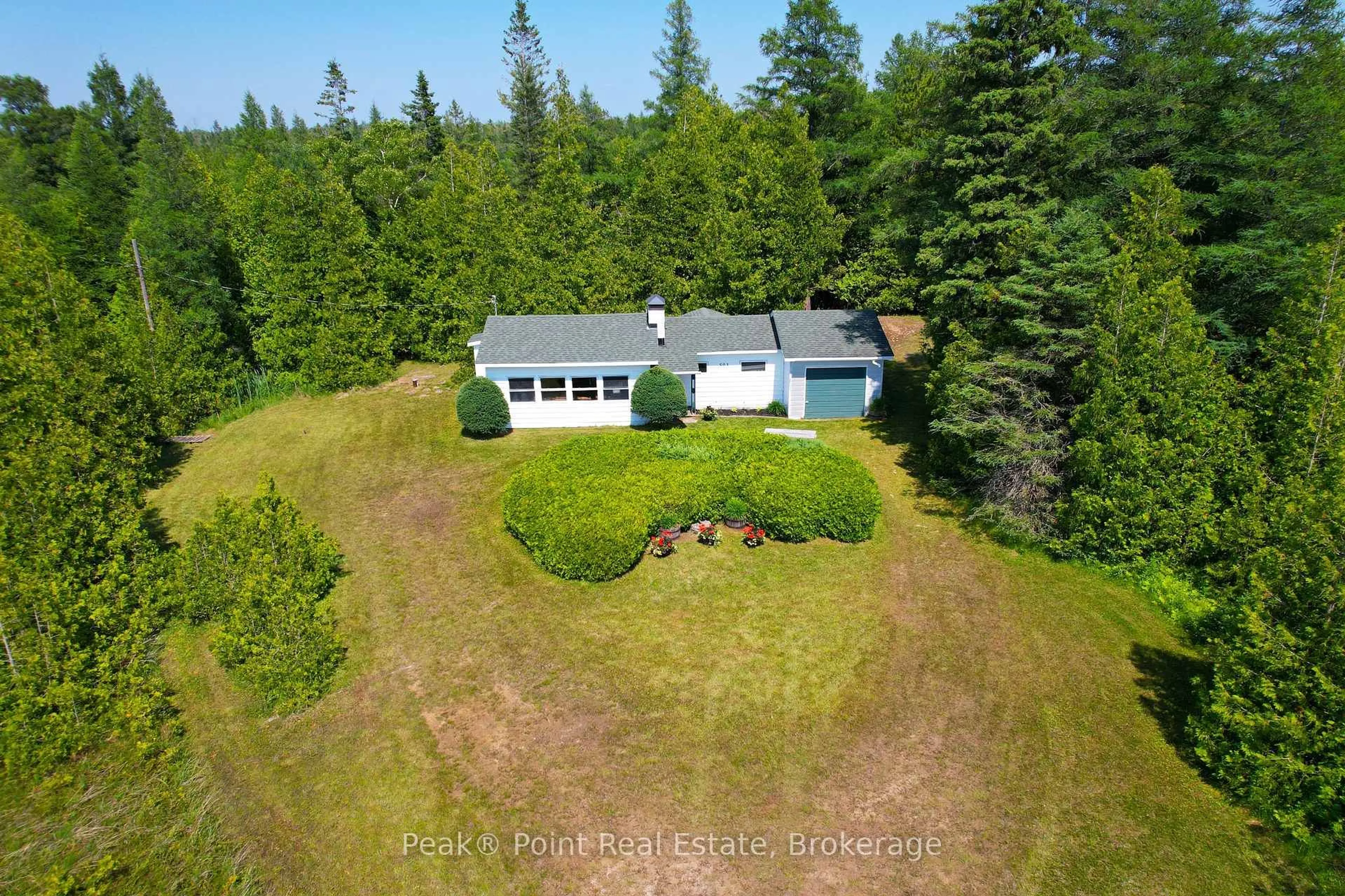 A pic from outside/outdoor area/front of a property/back of a property/a pic from drone, forest/trees view for 503 Bay St, South Bruce Peninsula Ontario N0H 2T0