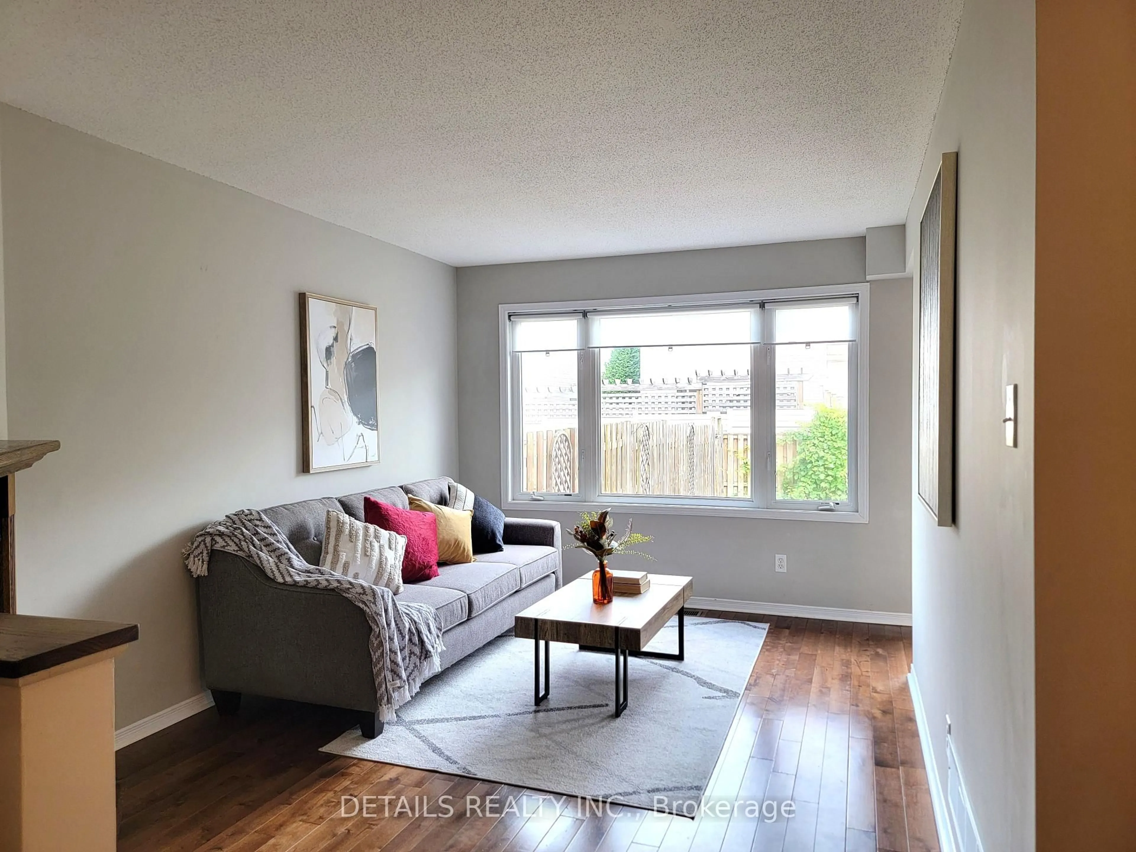 Living room with furniture, wood/laminate floor for 21 UPNEY Dr, Ottawa Ontario K2J 5G7