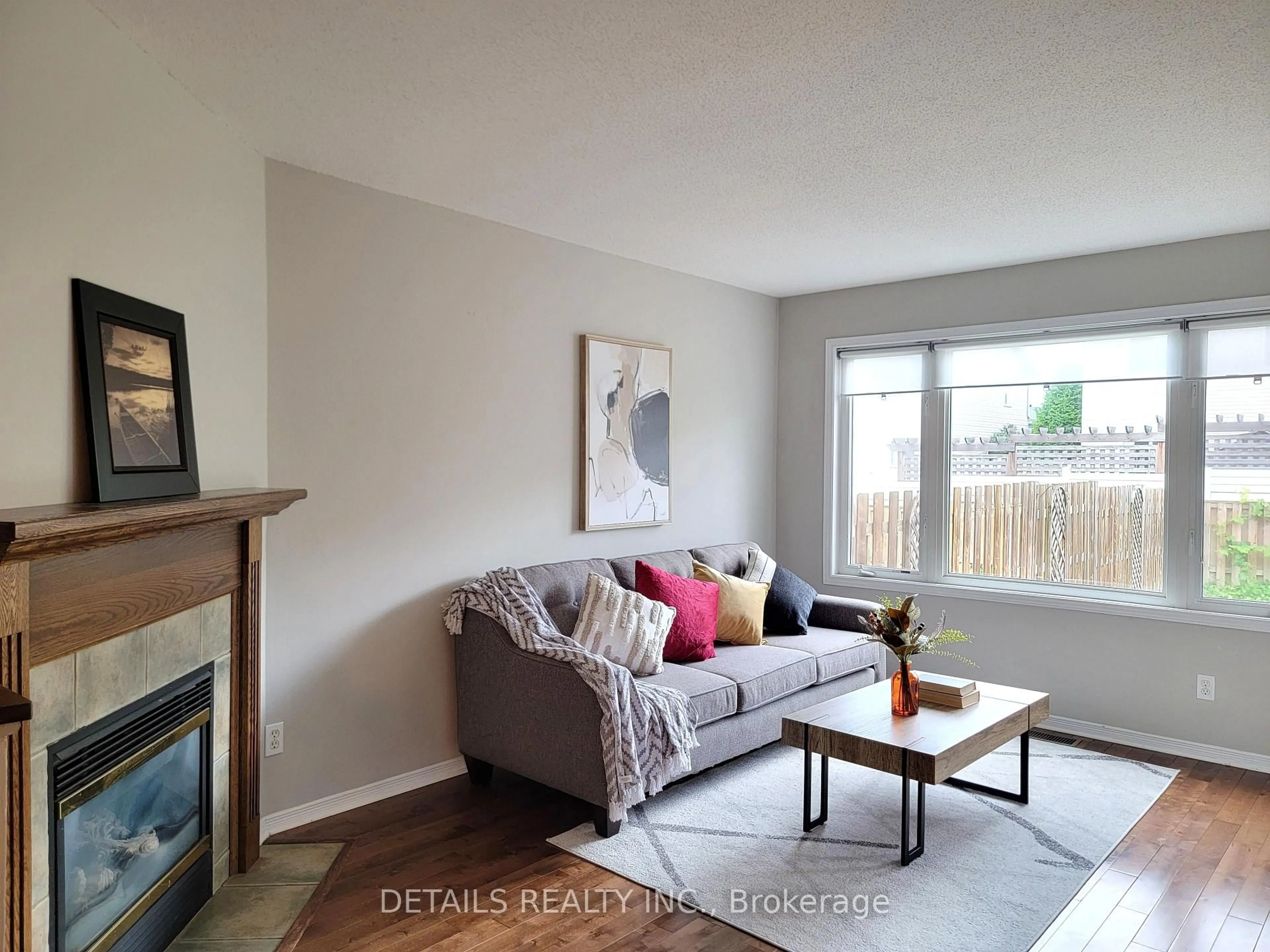 Living room with furniture, wood/laminate floor for 21 UPNEY Dr, Ottawa Ontario K2J 5G7