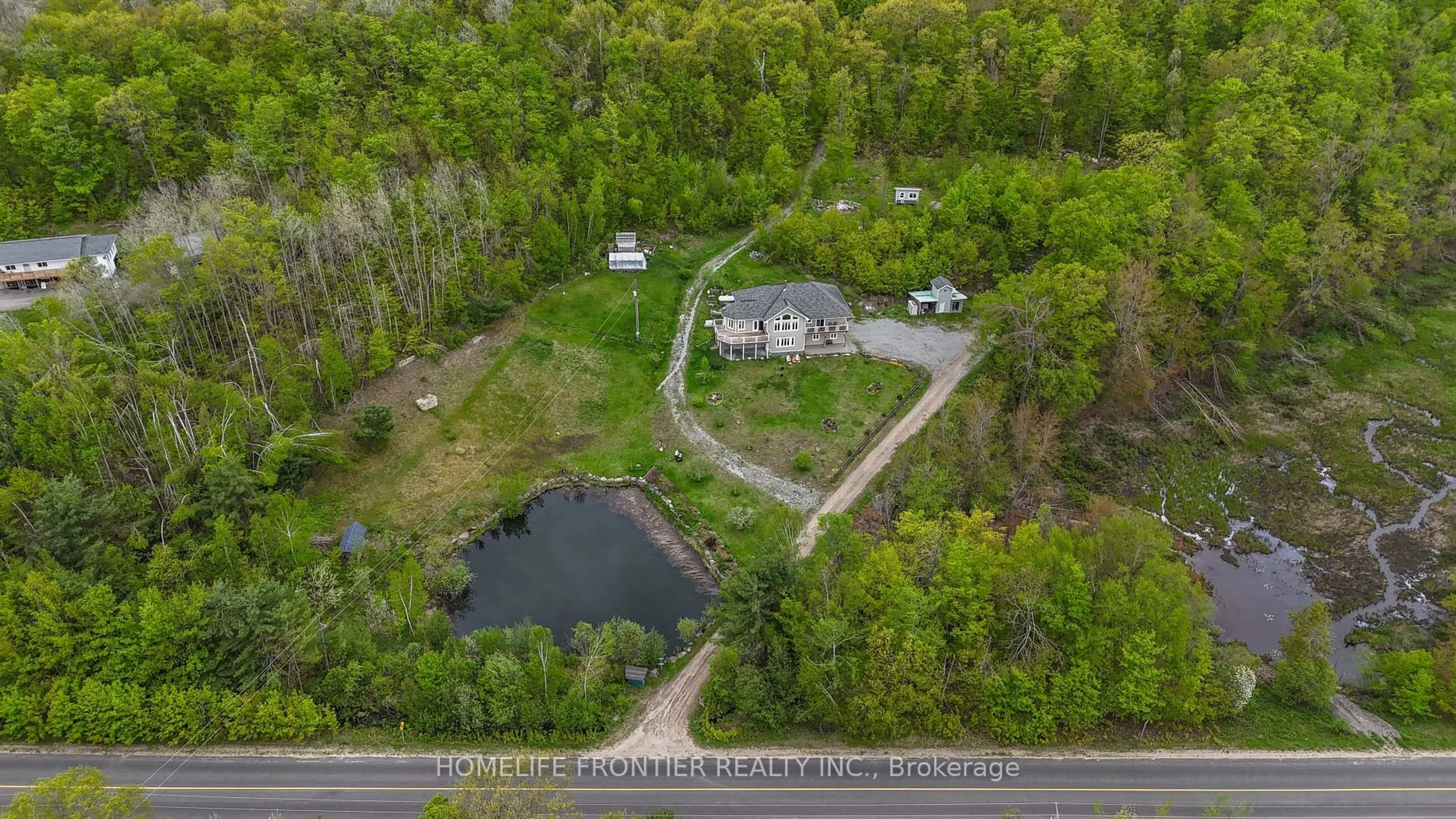 A pic from outside/outdoor area/front of a property/back of a property/a pic from drone, water/lake/river/ocean view for 1019 Silk Lane, Minden Hills Ontario K0M 2K0