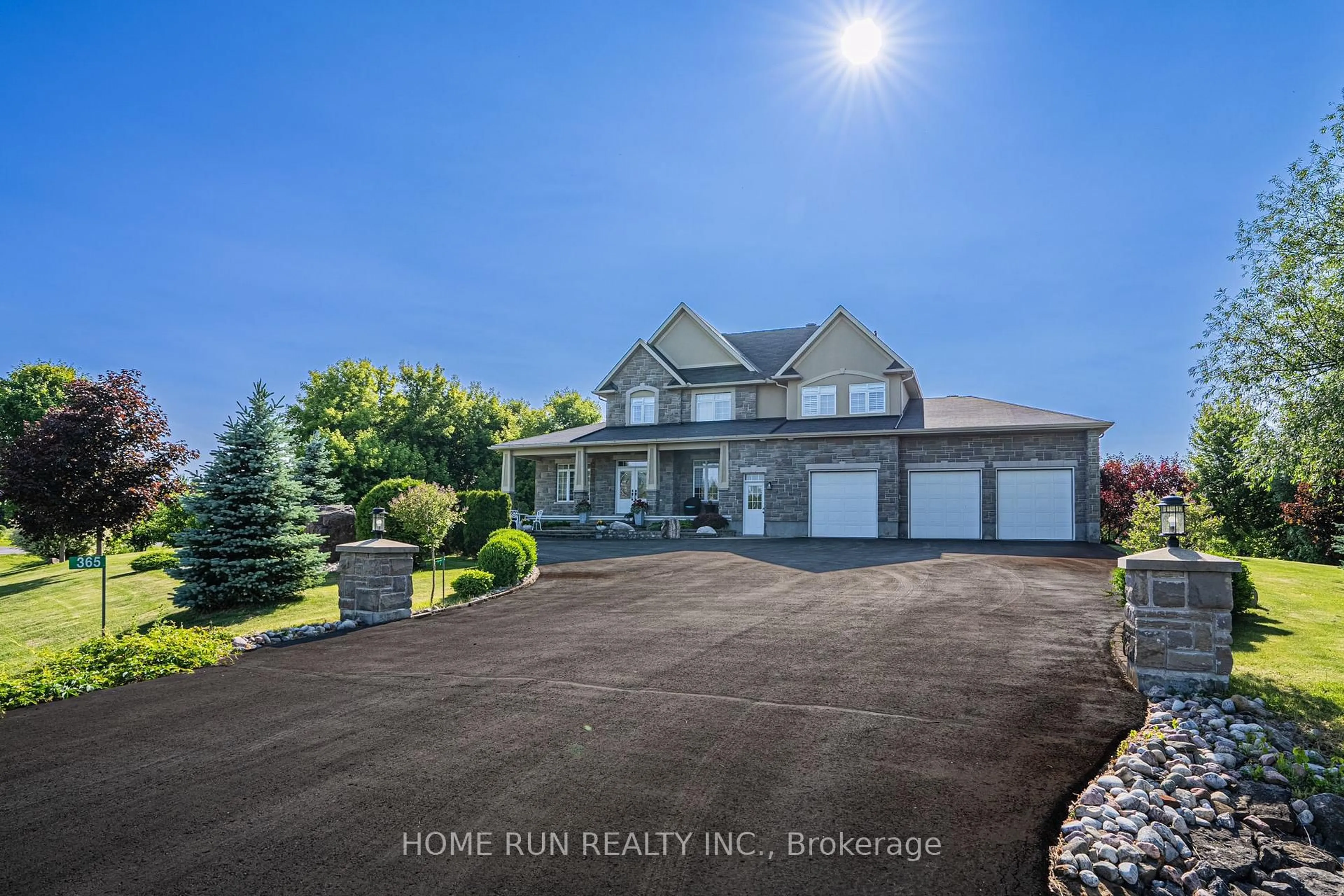 A pic from outside/outdoor area/front of a property/back of a property/a pic from drone, water/lake/river/ocean view for 365 West Lake Circ, Carp Ontario K0A 1L0