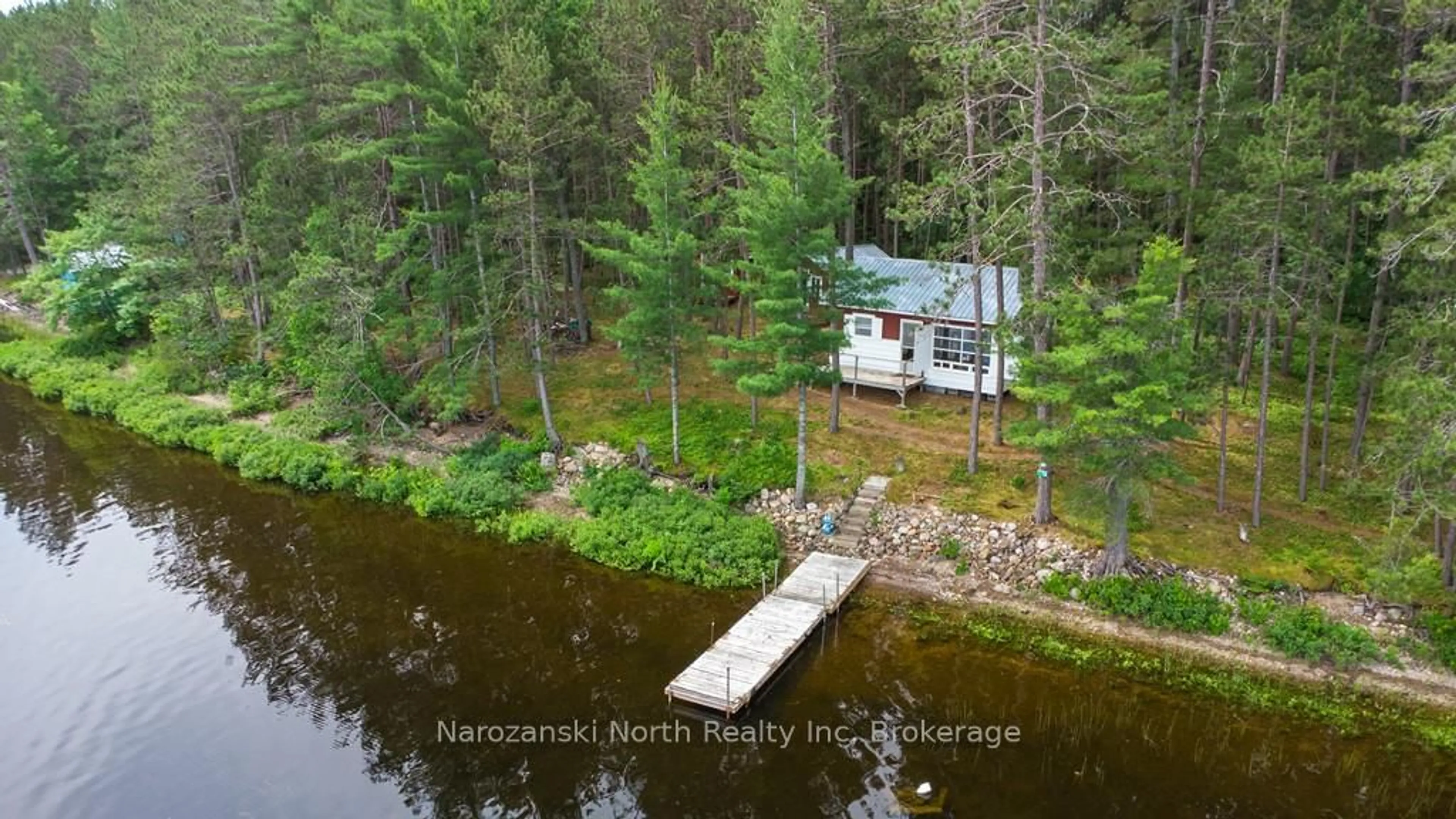 A pic from outside/outdoor area/front of a property/back of a property/a pic from drone, water/lake/river/ocean view for 56 Eighteen Mile Island, French River Ontario P0M 1A0