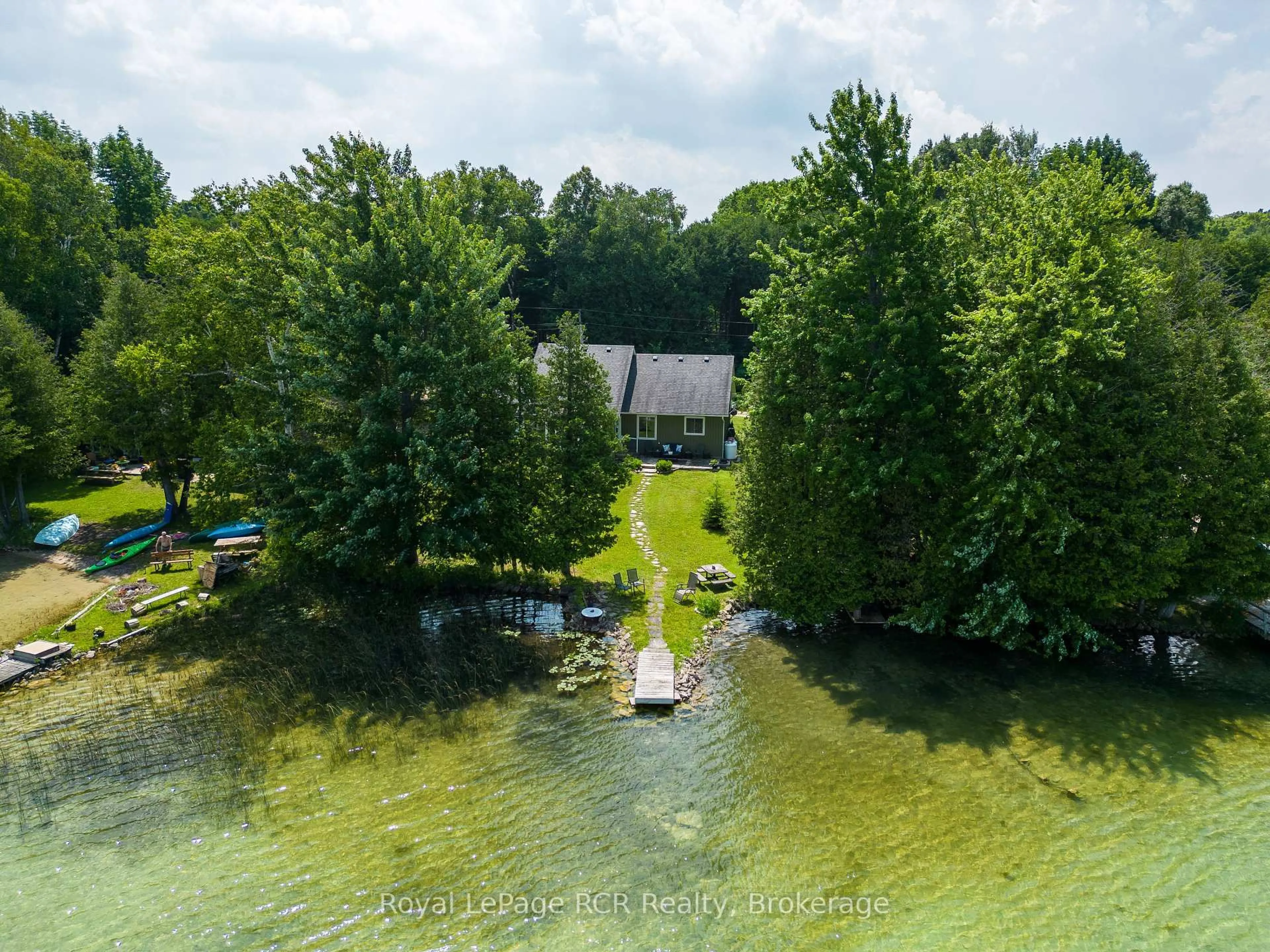 A pic from outside/outdoor area/front of a property/back of a property/a pic from drone, water/lake/river/ocean view for 121 Browns Lane, Georgian Bluffs Ontario N0H 2K0