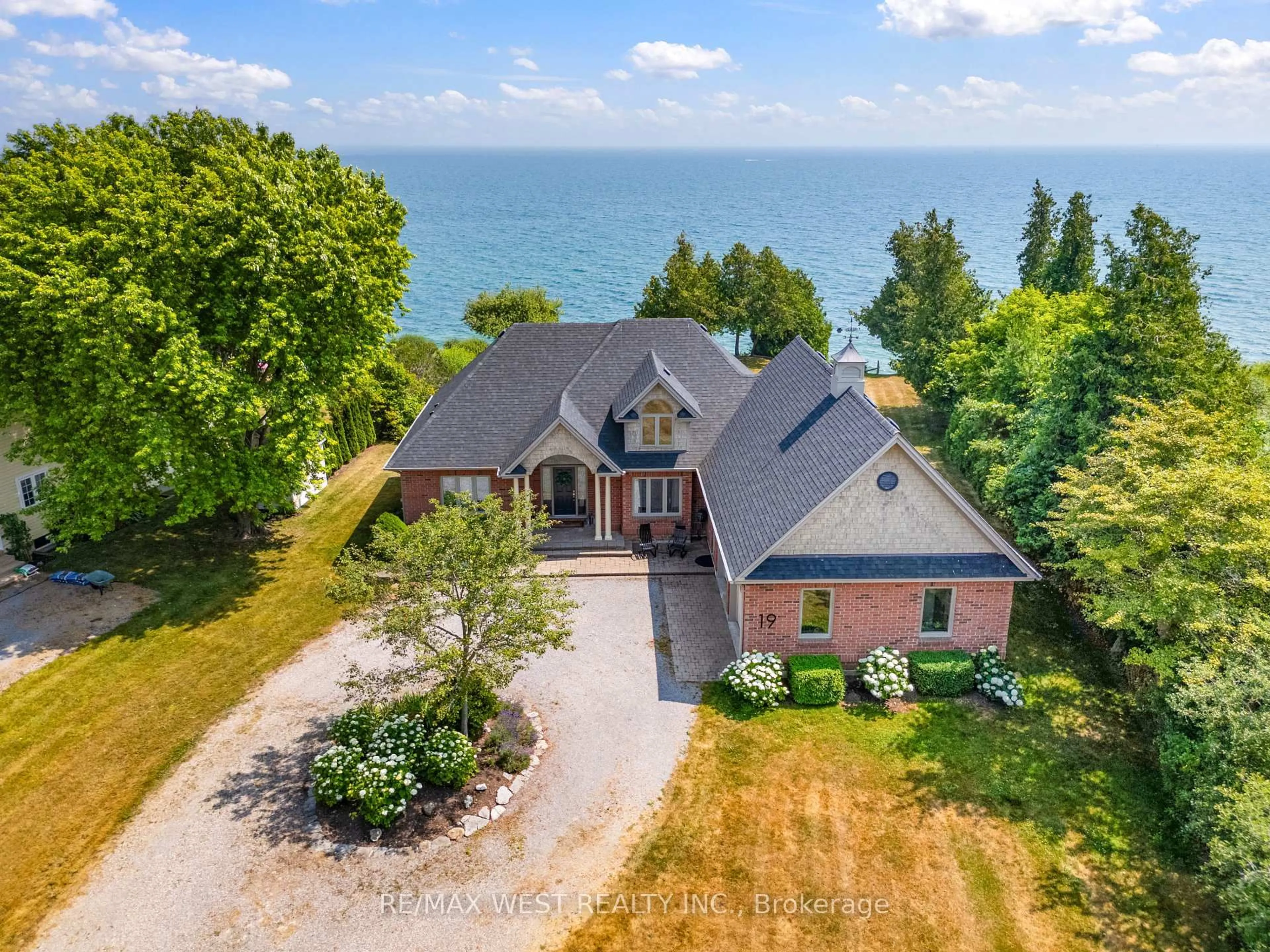 A pic from outside/outdoor area/front of a property/back of a property/a pic from drone, water/lake/river/ocean view for 19 Skiff Cove Road, Prince Edward County Ontario K0K 3L0