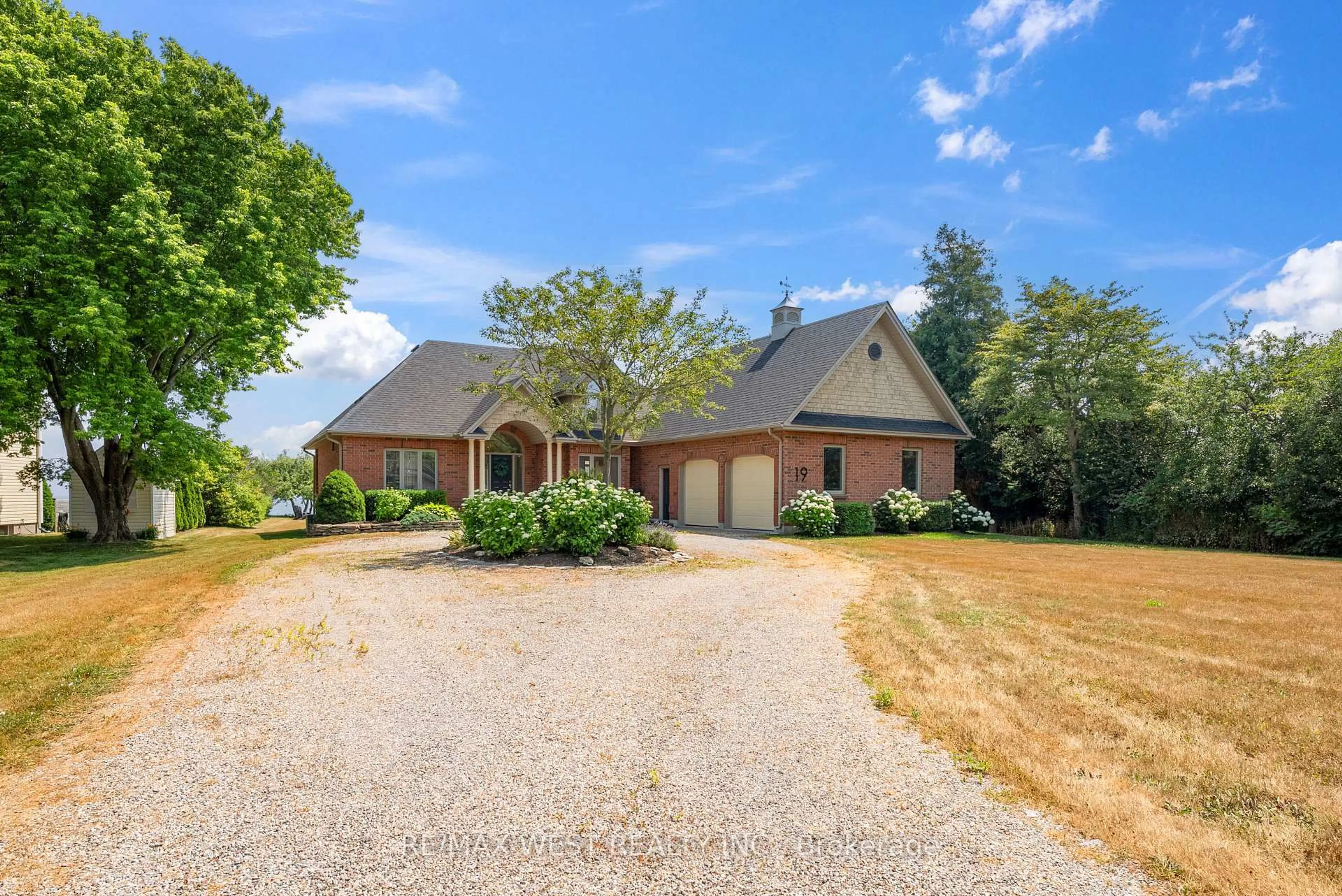 A pic from outside/outdoor area/front of a property/back of a property/a pic from drone, water/lake/river/ocean view for 19 Skiff Cove Road, Prince Edward County Ontario K0K 3L0