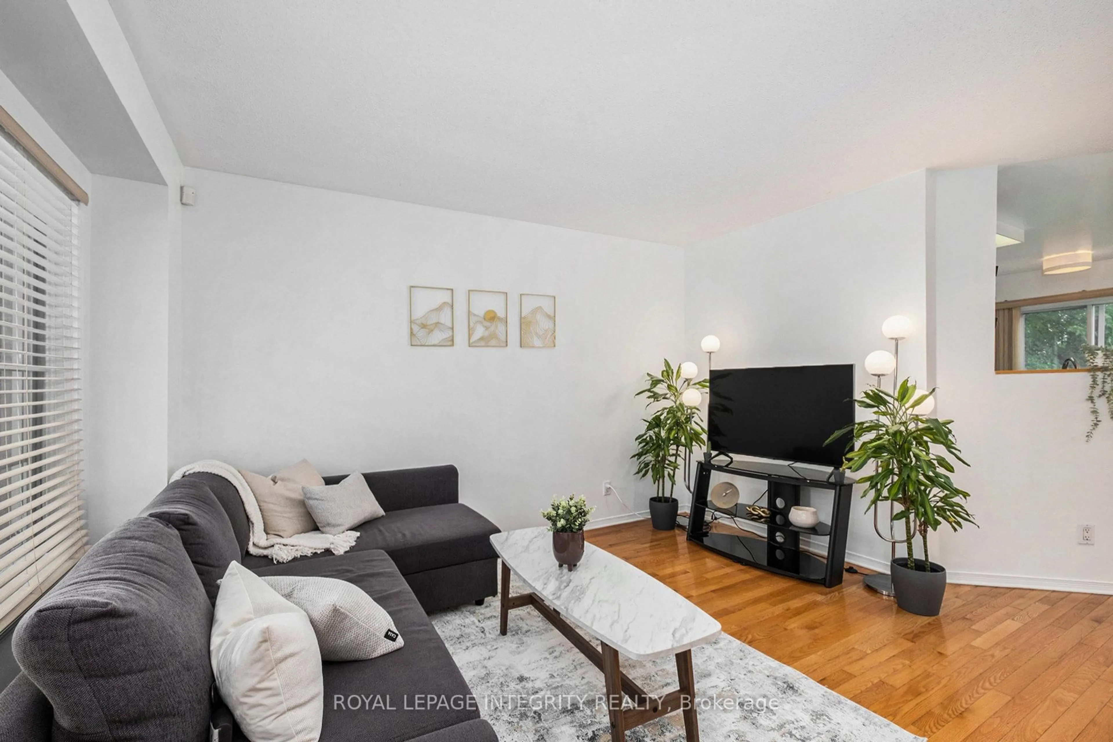 Living room with furniture, wood/laminate floor for 141 Inverkip Ave, Ottawa Ontario K1T 4C3