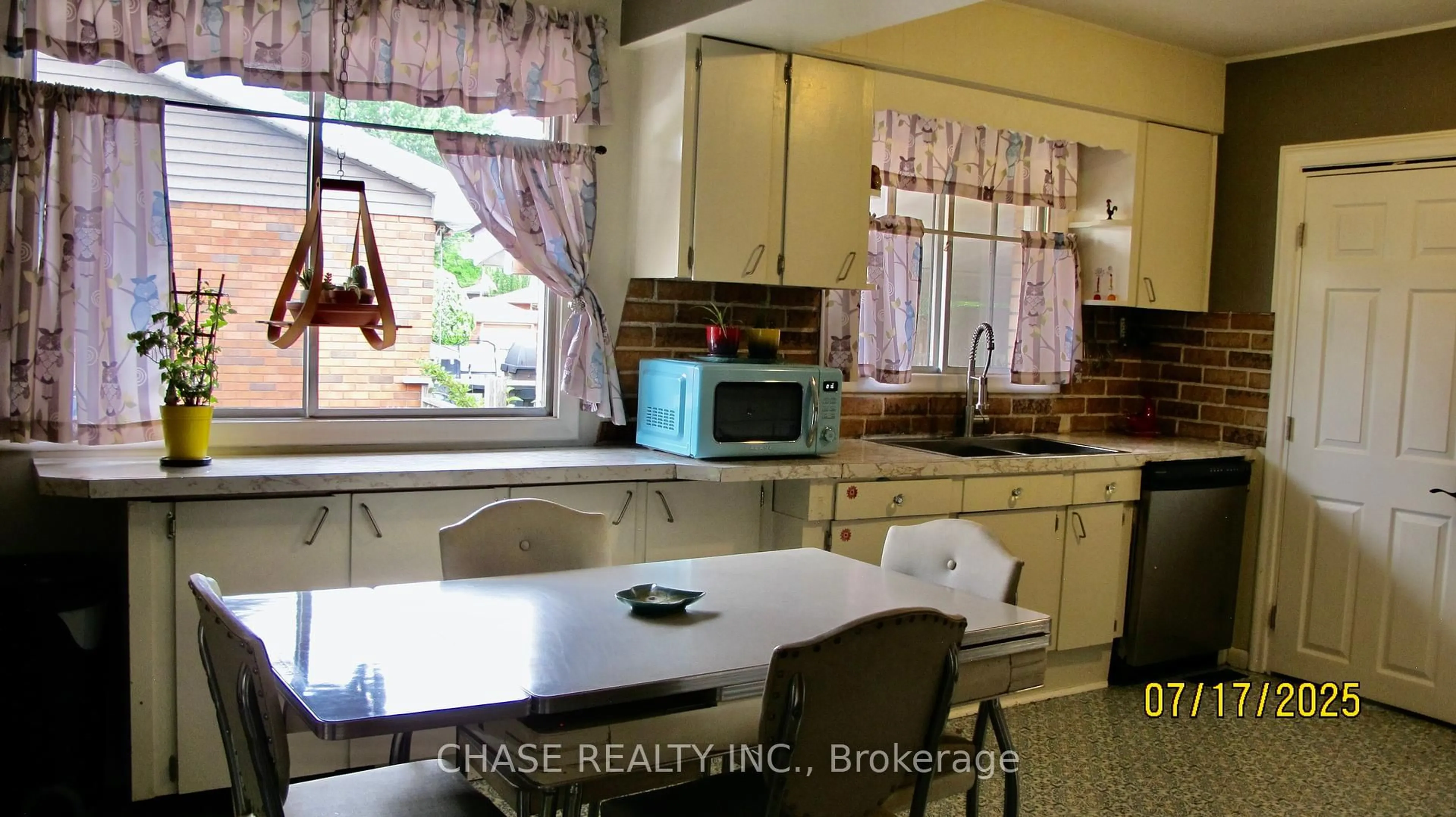 Open concept kitchen, wood/laminate floor for 159 Queensdale Ave, Hamilton Ontario L9A 1K7