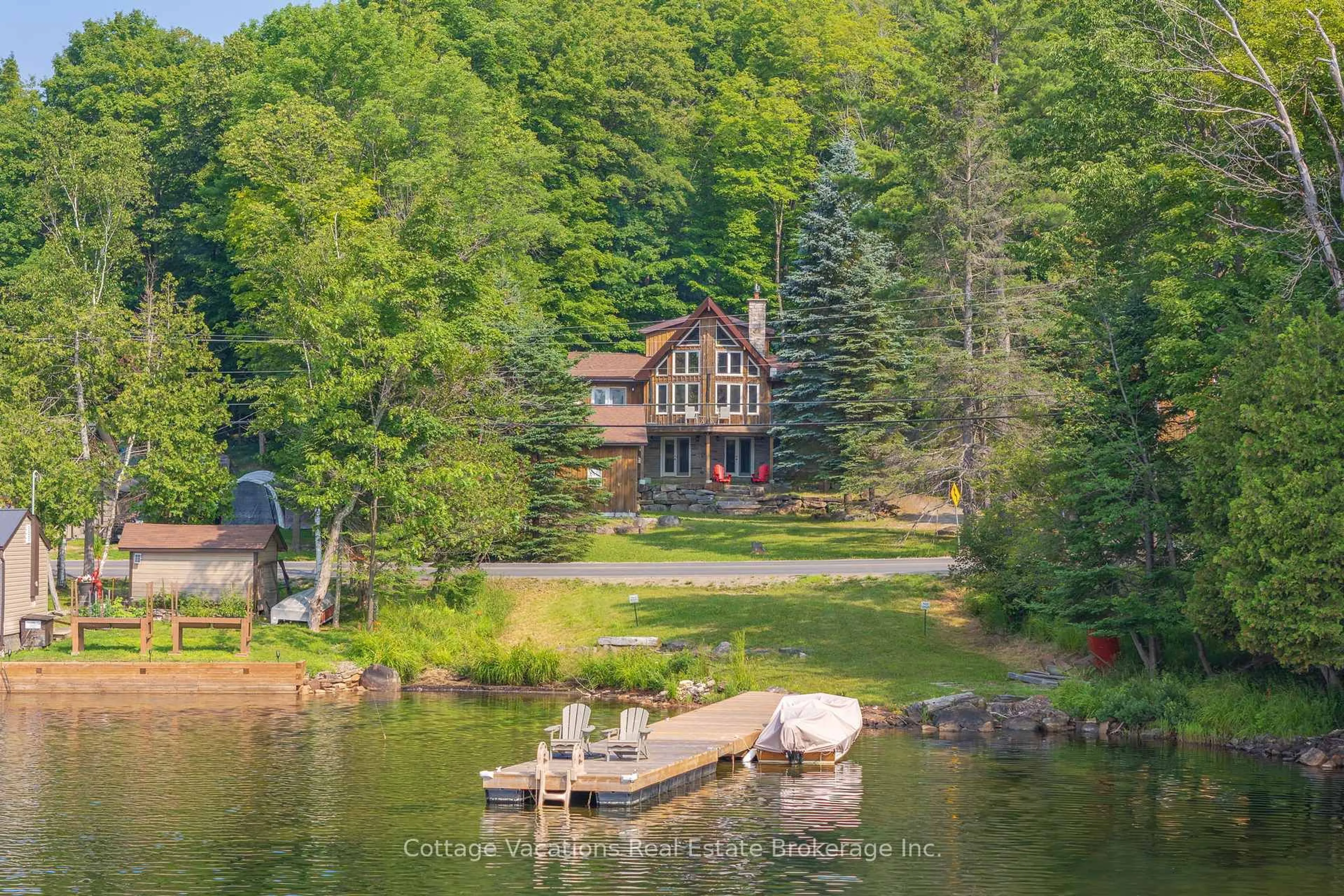 A pic from outside/outdoor area/front of a property/back of a property/a pic from drone, water/lake/river/ocean view for 1292 Port Cunnington Rd, Lake of Bays Ontario P0A 1H0