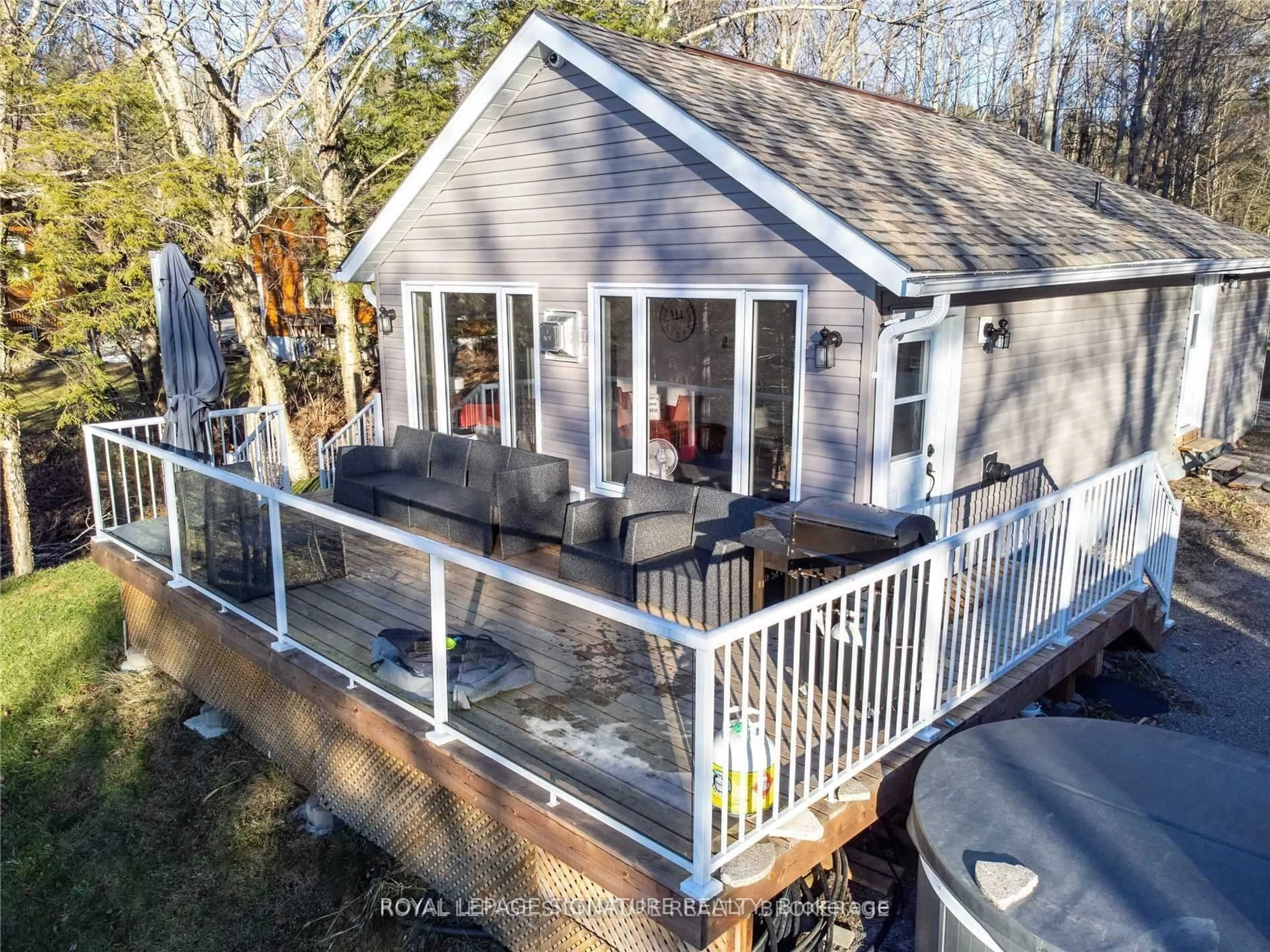 A pic from outside/outdoor area/front of a property/back of a property/a pic from drone, water/lake/river/ocean view for 1051 Norley Dr, Algonquin Highlands Ontario K0M 1J1