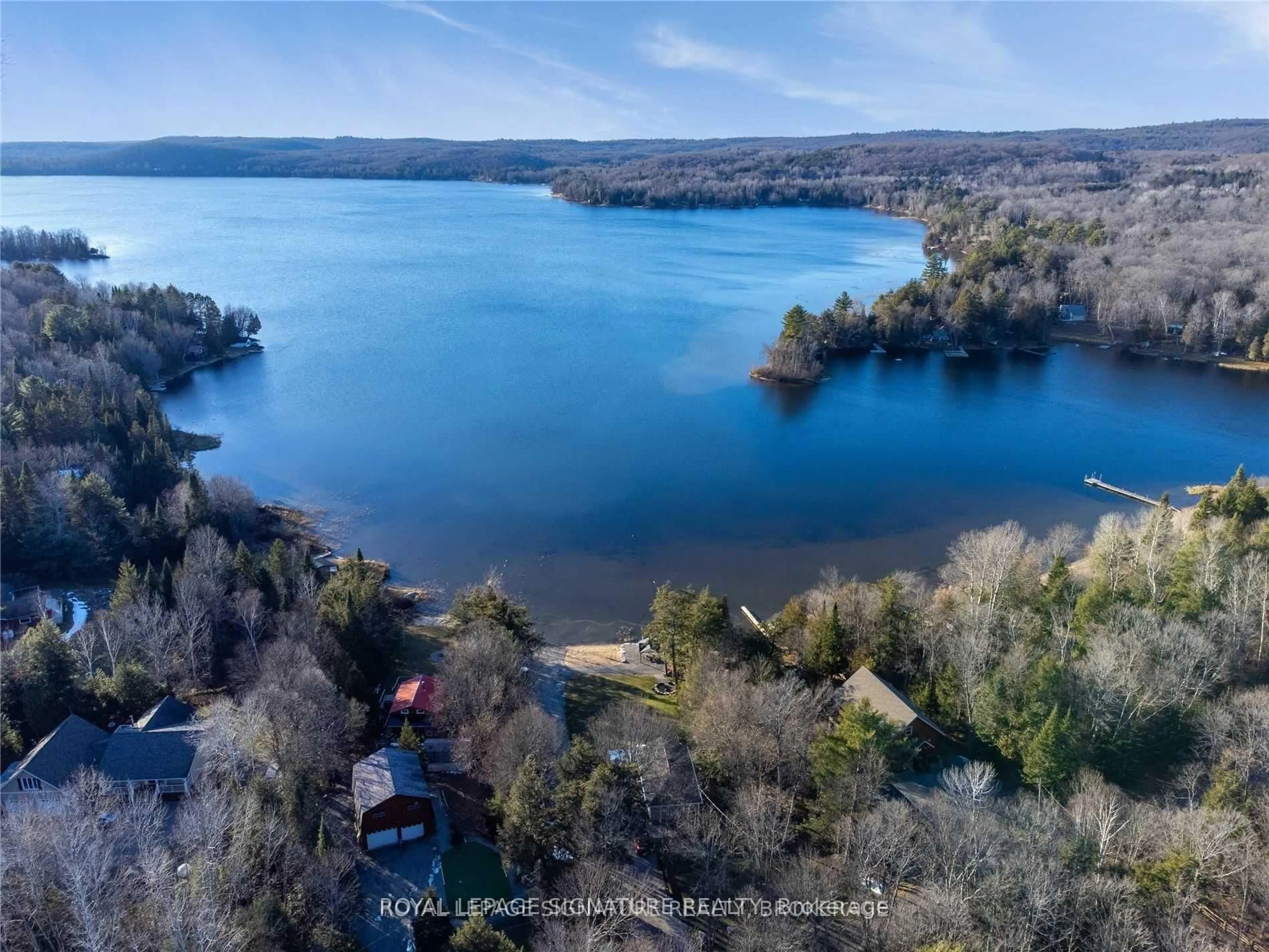 A pic from outside/outdoor area/front of a property/back of a property/a pic from drone, water/lake/river/ocean view for 1051 Norley Dr, Algonquin Highlands Ontario K0M 1J1