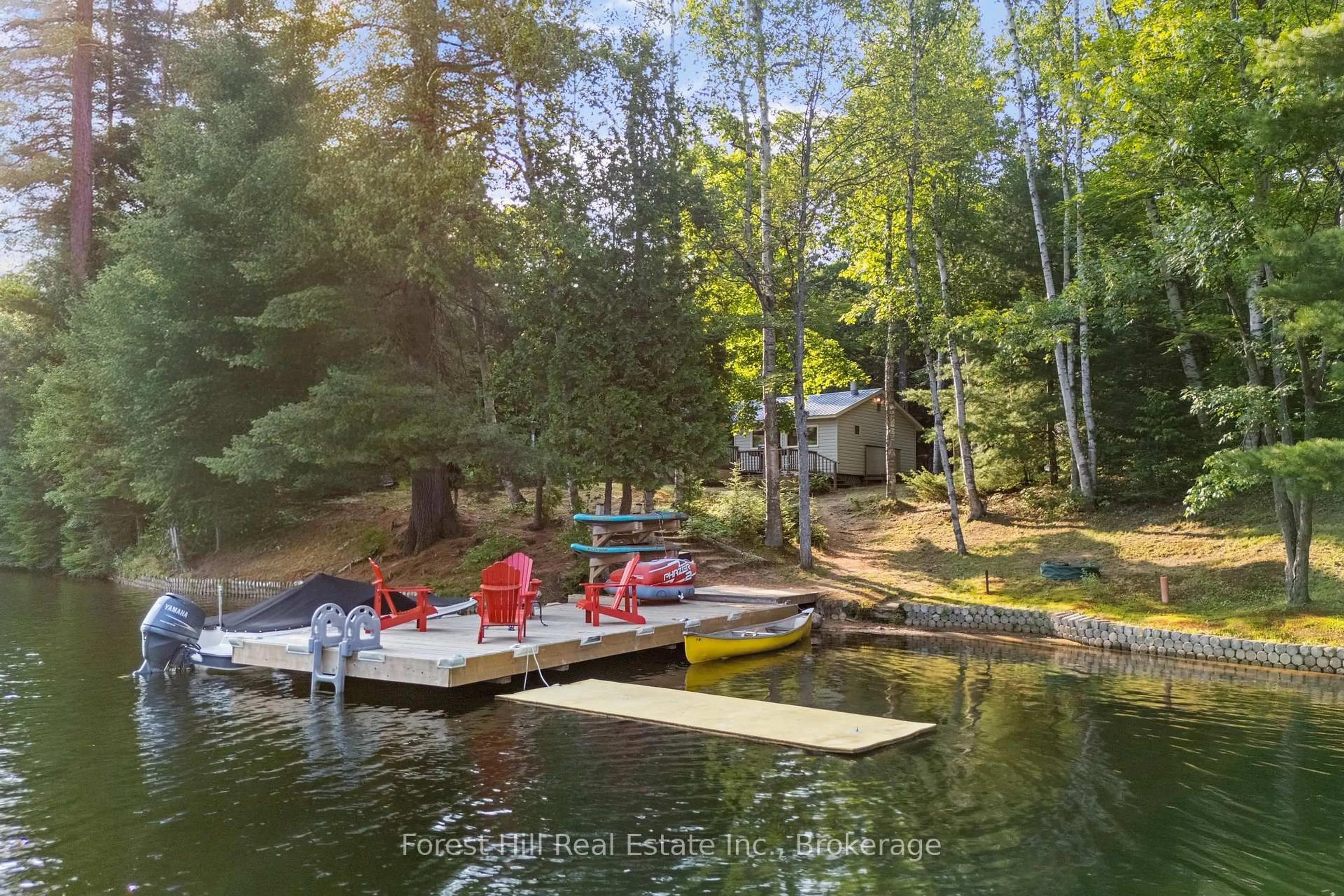 A pic from outside/outdoor area/front of a property/back of a property/a pic from drone, water/lake/river/ocean view for 1008 Summit Dr, Algonquin Highlands Ontario P0A 1E0