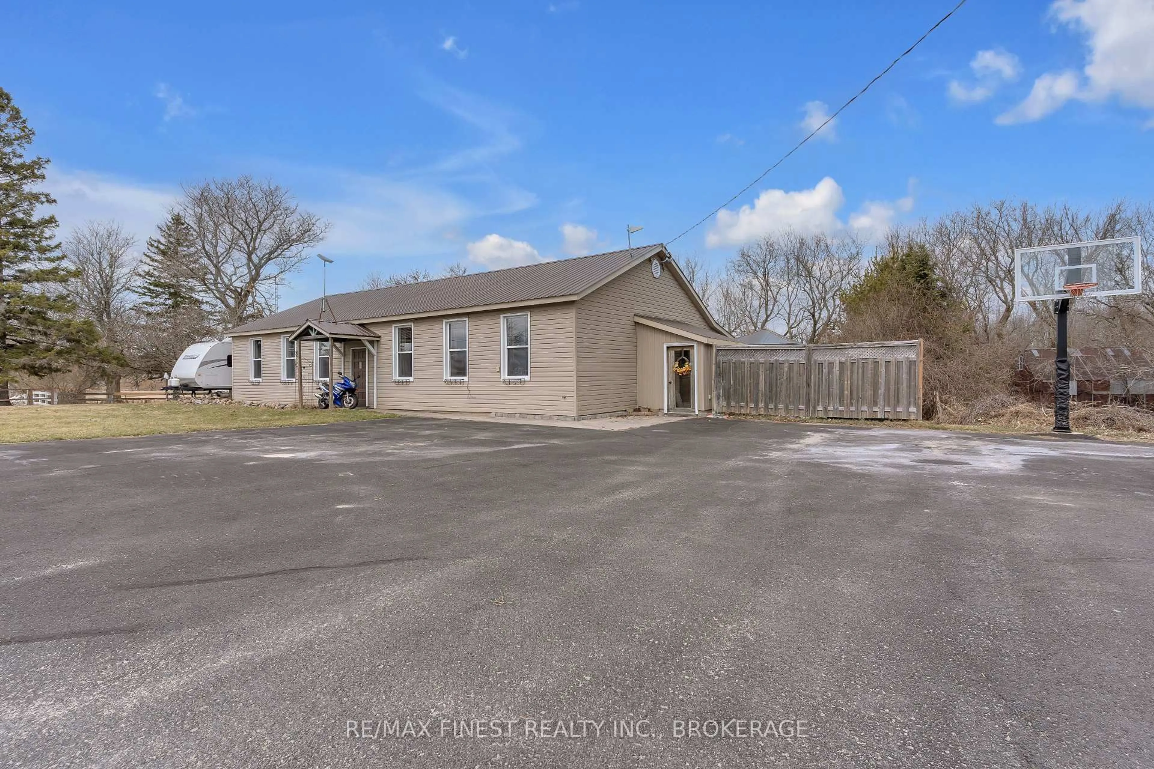 A pic from outside/outdoor area/front of a property/back of a property/a pic from drone, street for 6955 County 2 Rd, Napanee Ontario K7R 3K6