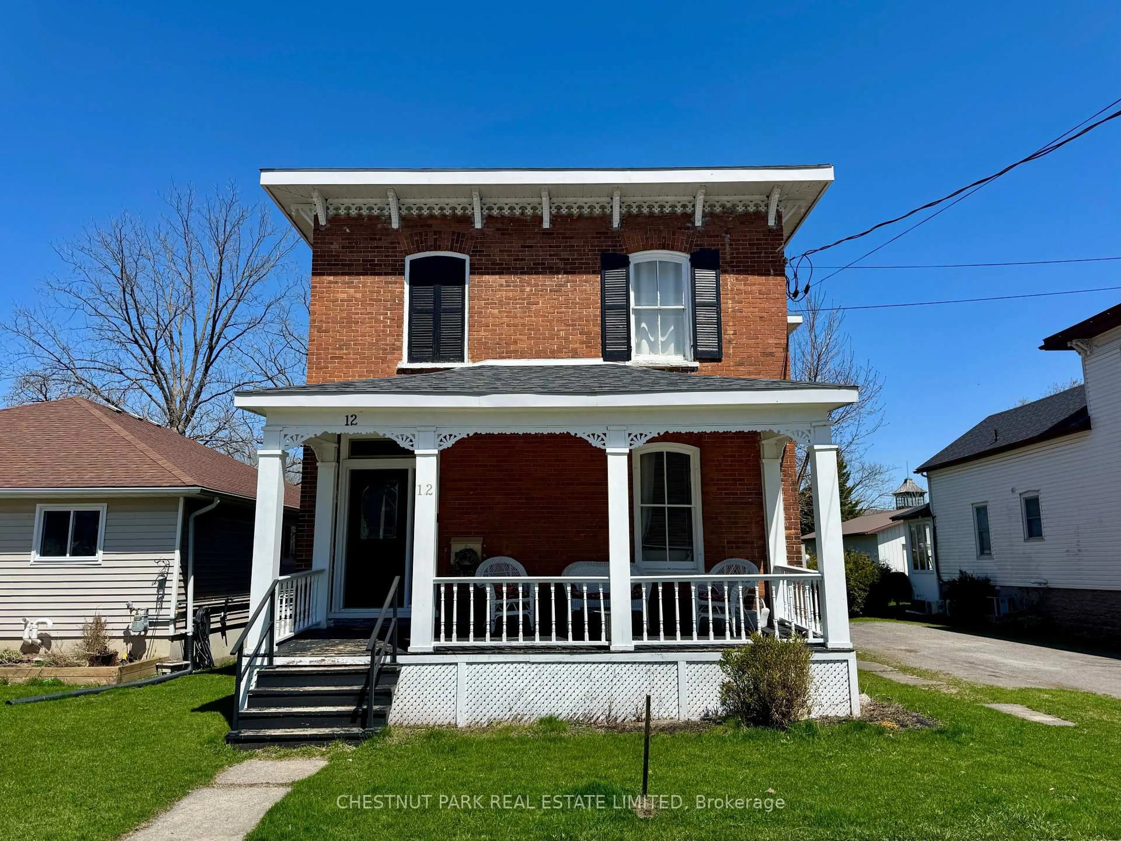 Home with brick exterior material, street for 12 Maple Ave, Prince Edward County Ontario K0K 2T0