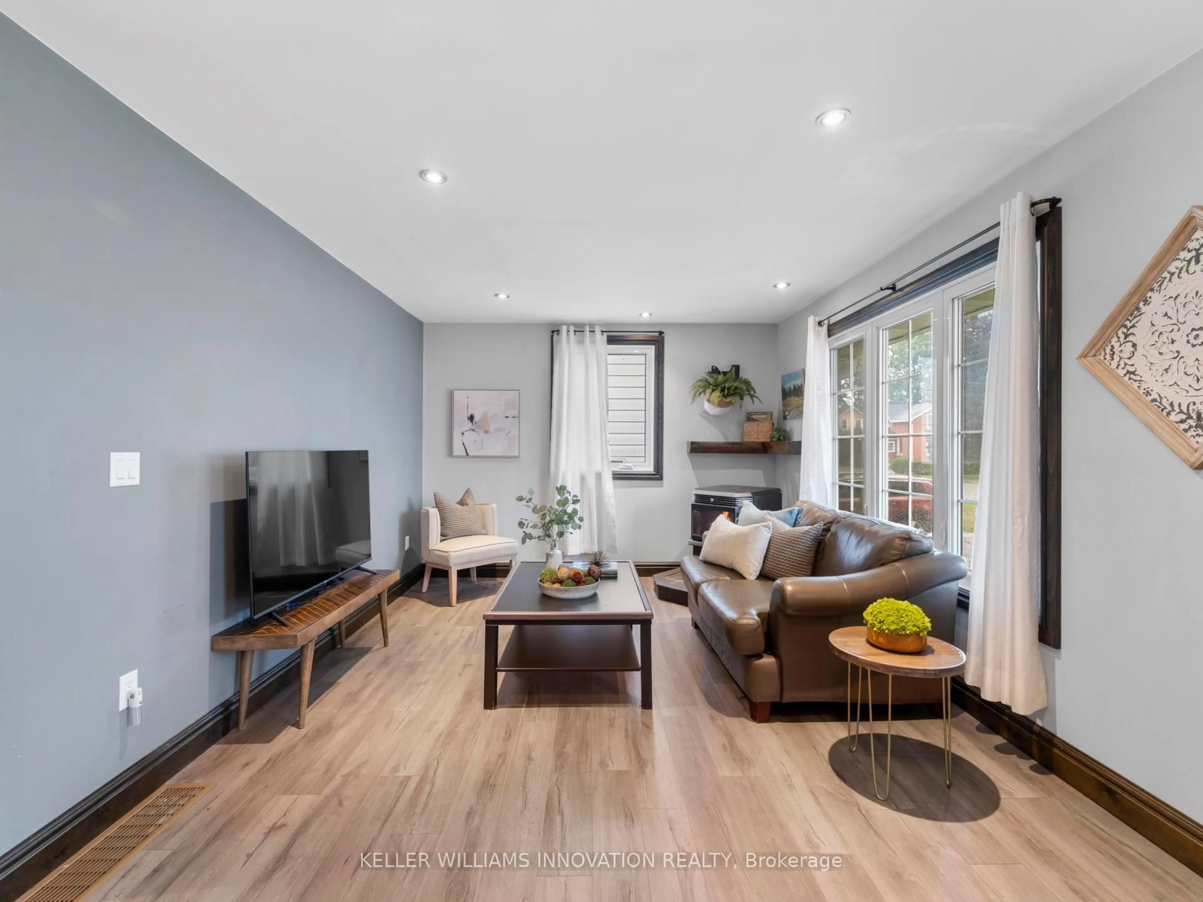 Living room with furniture, wood/laminate floor for 6992 Raglan St, West Perth Ontario N0K 1E0