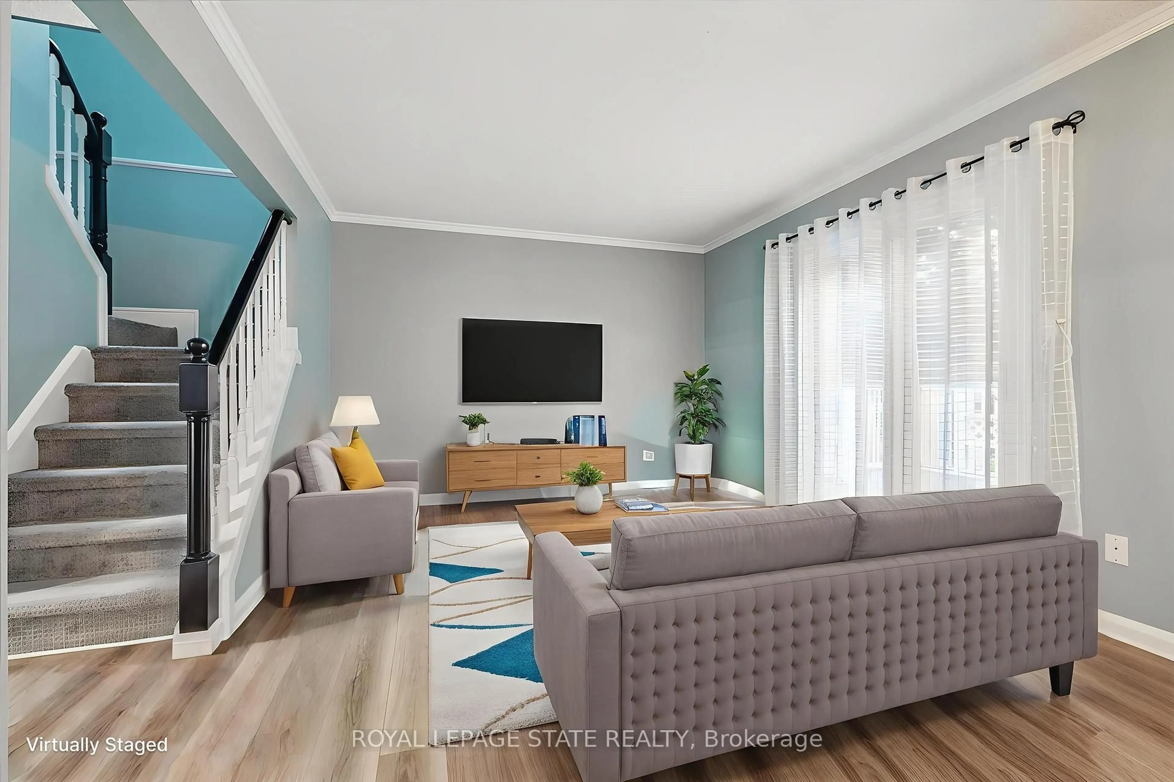 Living room with furniture, wood/laminate floor for 22 Merritt Cres, Grimsby Ontario L3M 4X5