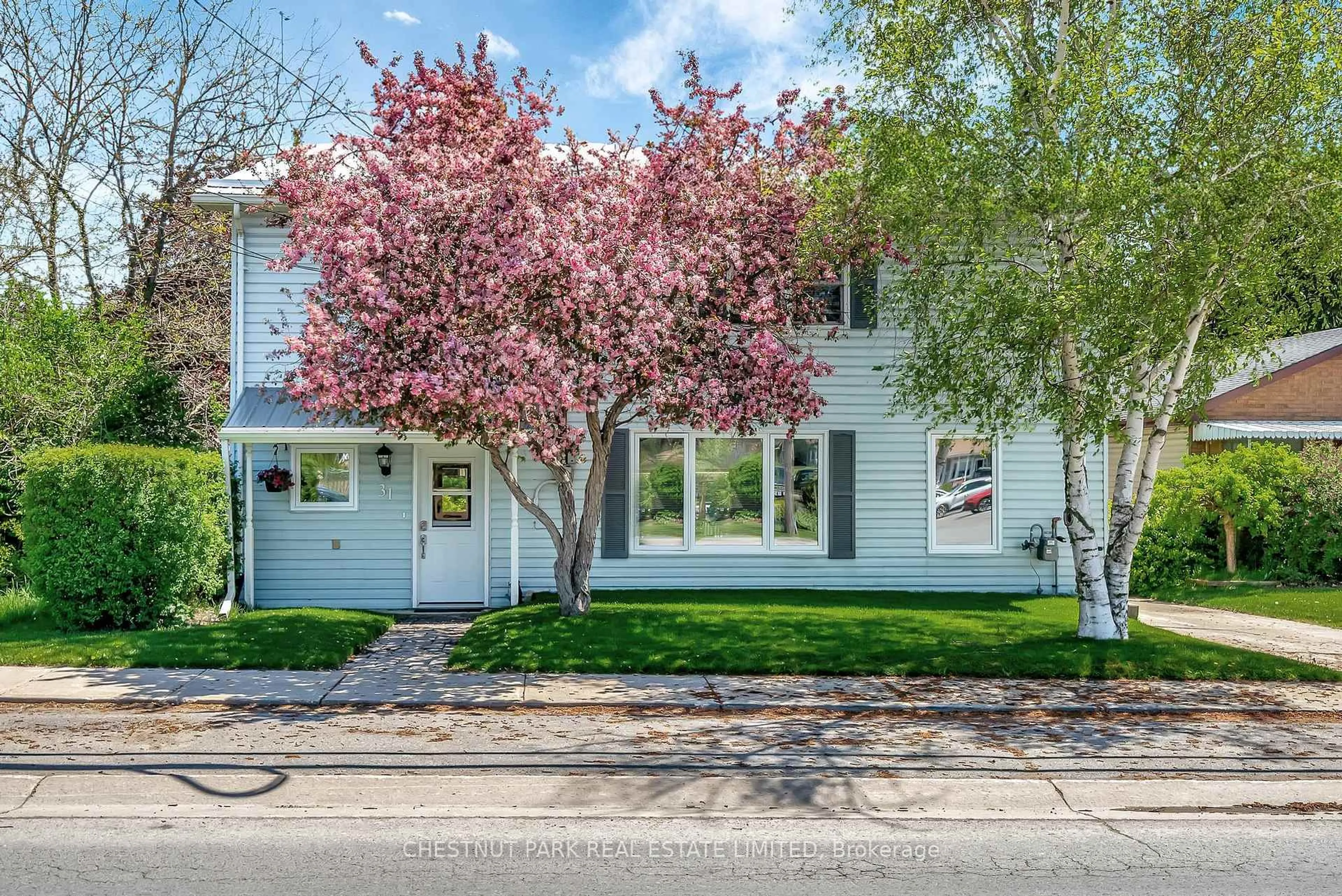 Home with vinyl exterior material, street for 31 Lake St, Prince Edward County Ontario K0K 2T0