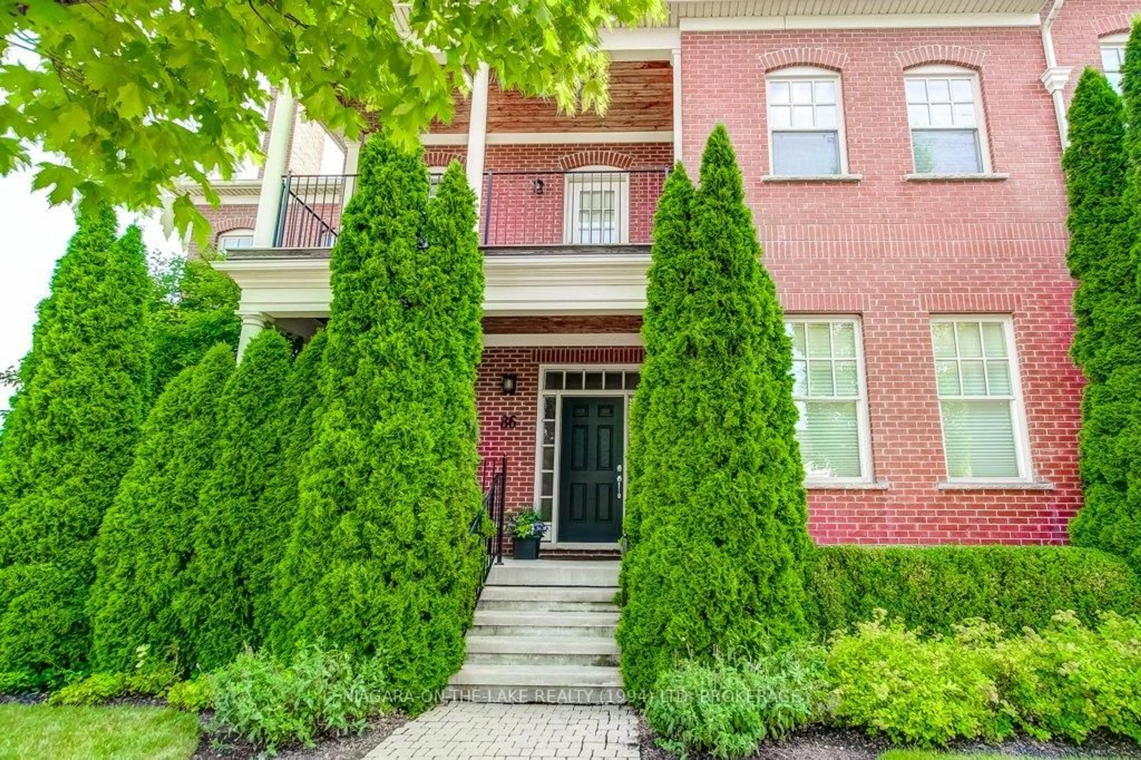 Home with brick exterior material, street for 86 GARRISON VILLAGE Dr, Niagara-on-the-Lake Ontario L0S 1J0