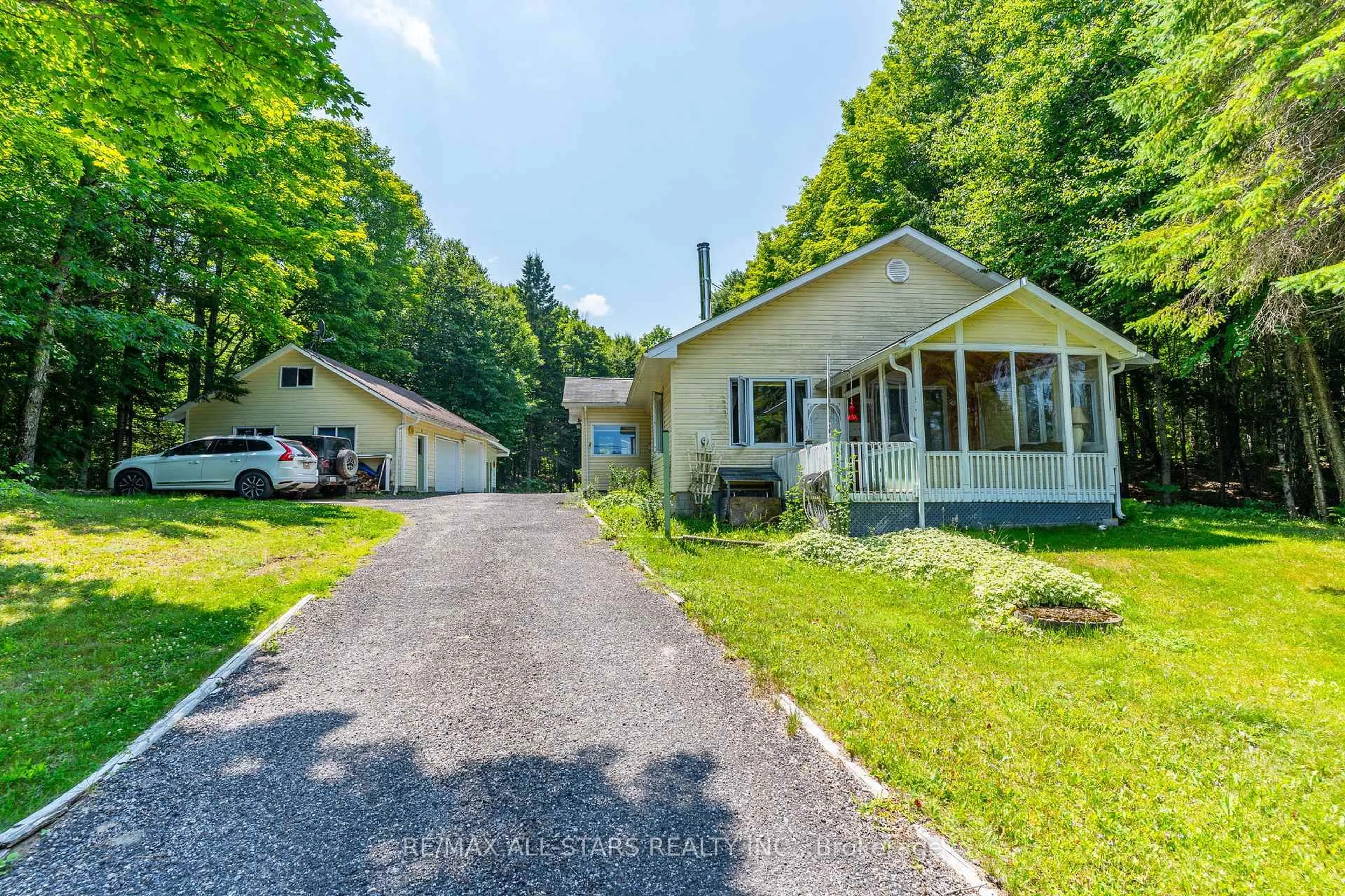 A pic from outside/outdoor area/front of a property/back of a property/a pic from drone, street for 18063 HIGHWAY 35 Highway, Algonquin Highlands Ontario K0M 1J2