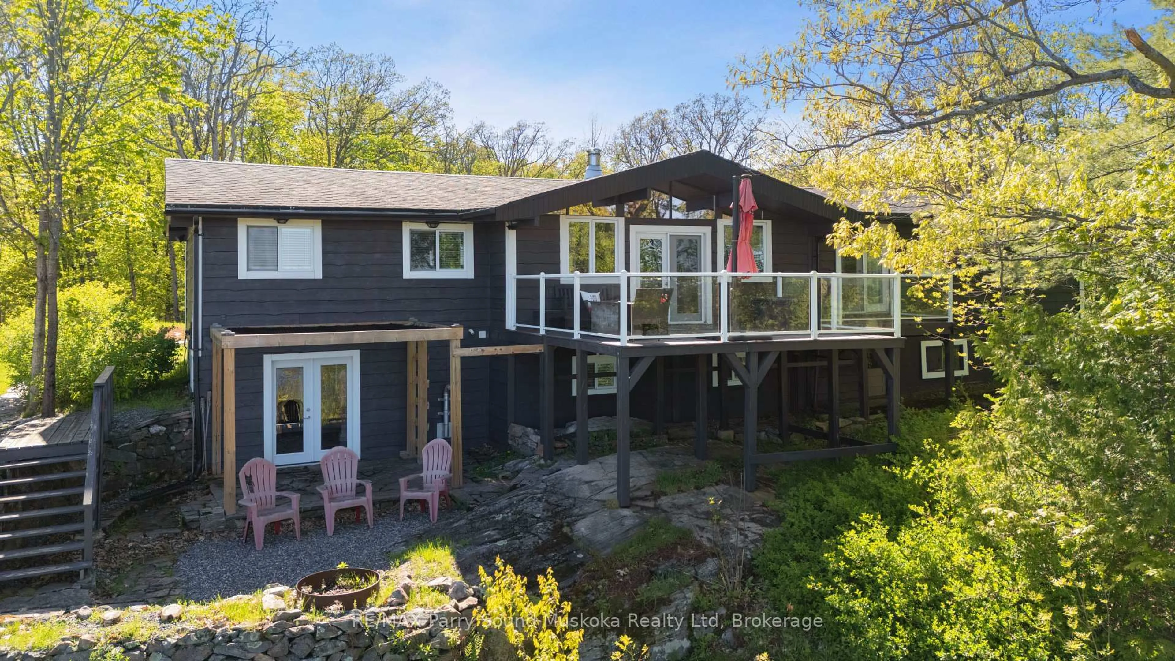 A pic from outside/outdoor area/front of a property/back of a property/a pic from drone, water/lake/river/ocean view for 143A Highway 612, Seguin Ontario P0C 1H0