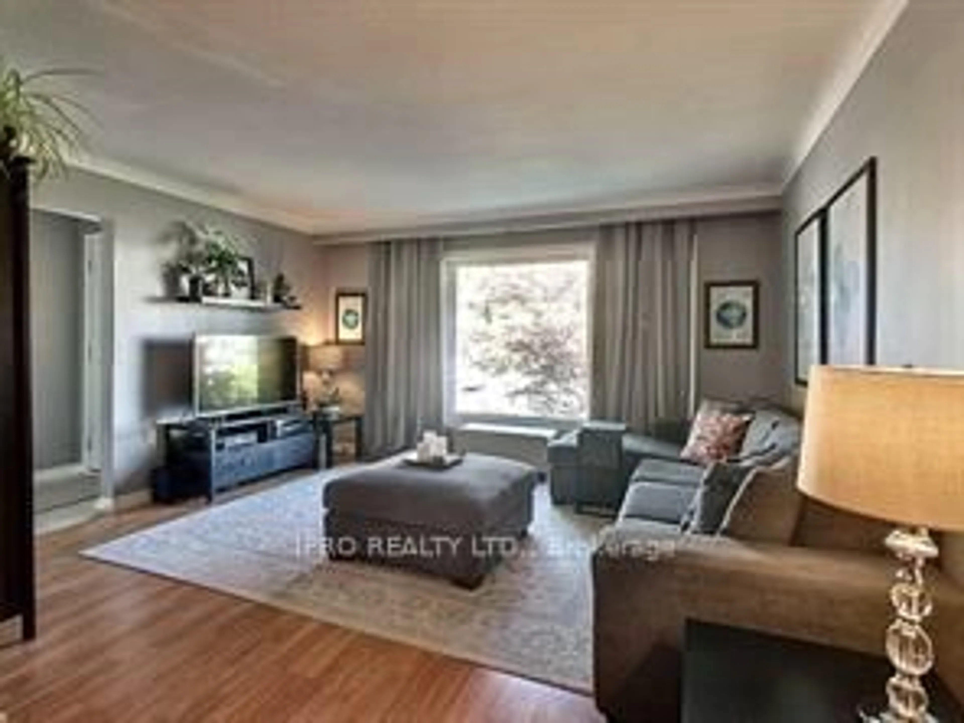 Living room with furniture, wood/laminate floor for 14 Canterbury Dr, St. Catharines Ontario L2P 3M7