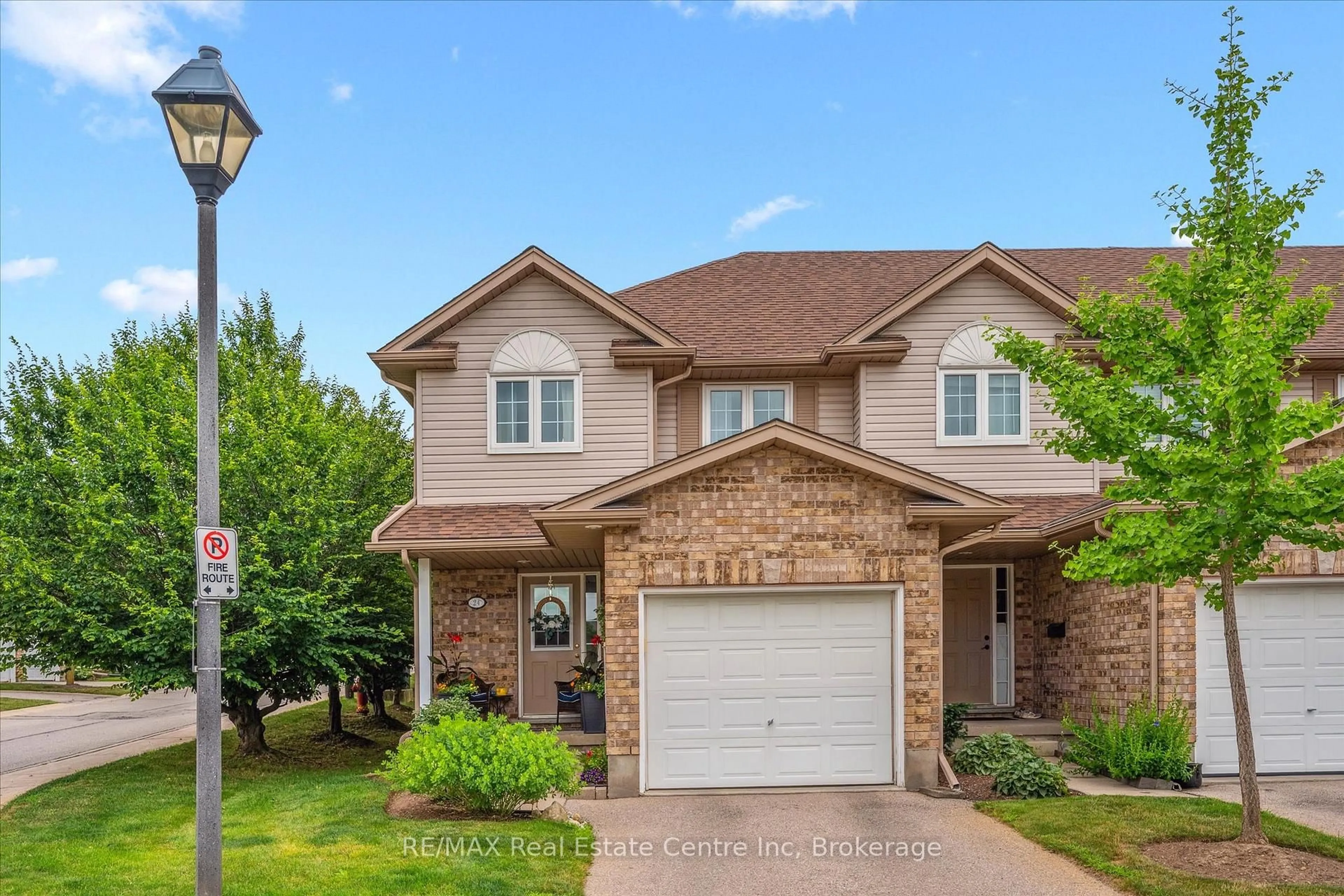Home with brick exterior material, street for 31 Schroder Cres #24, Guelph Ontario N1E 7M6