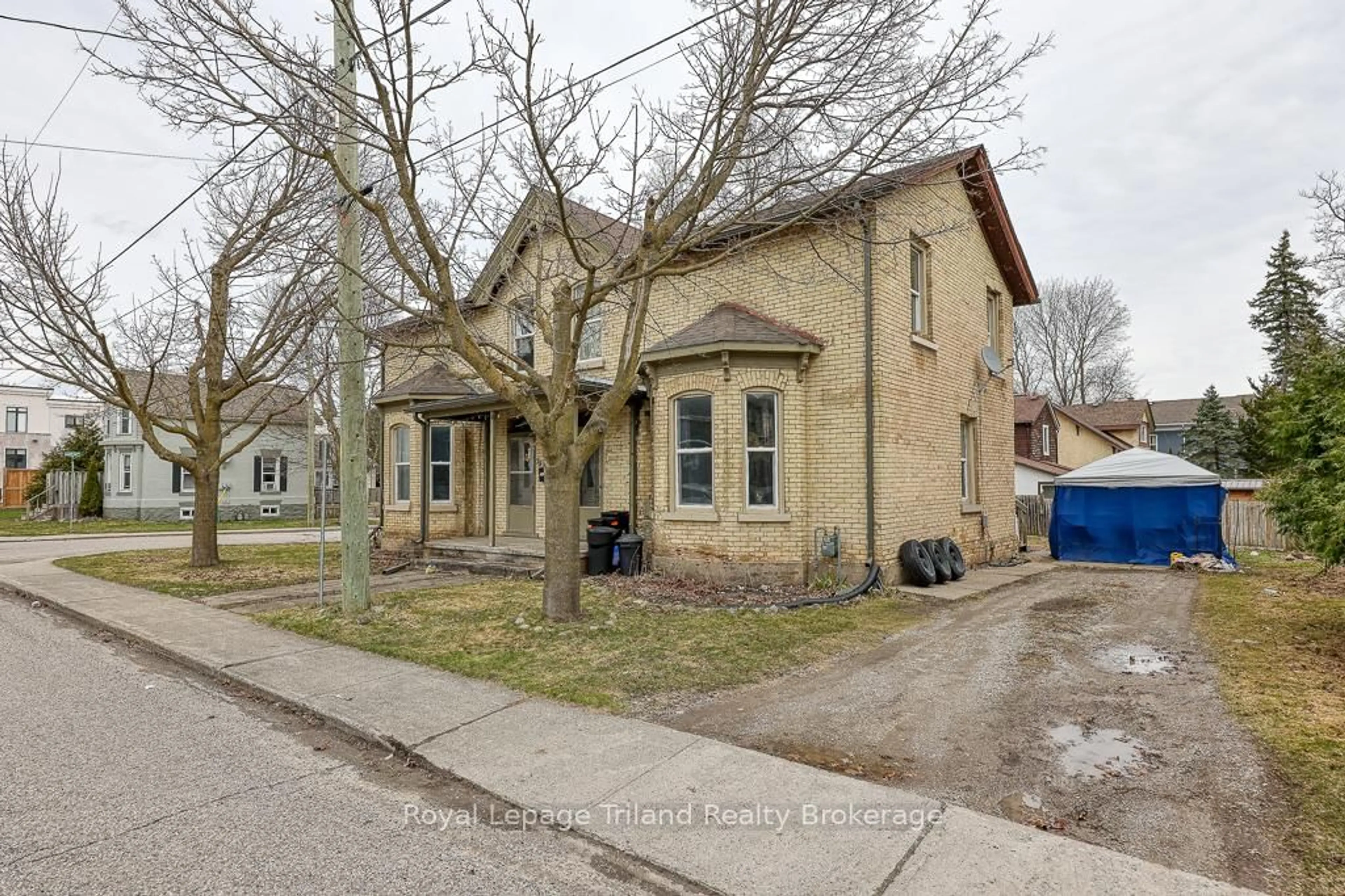Home with brick exterior material, street for 75 & 77 Reeve St, Woodstock Ontario N4S 3G7
